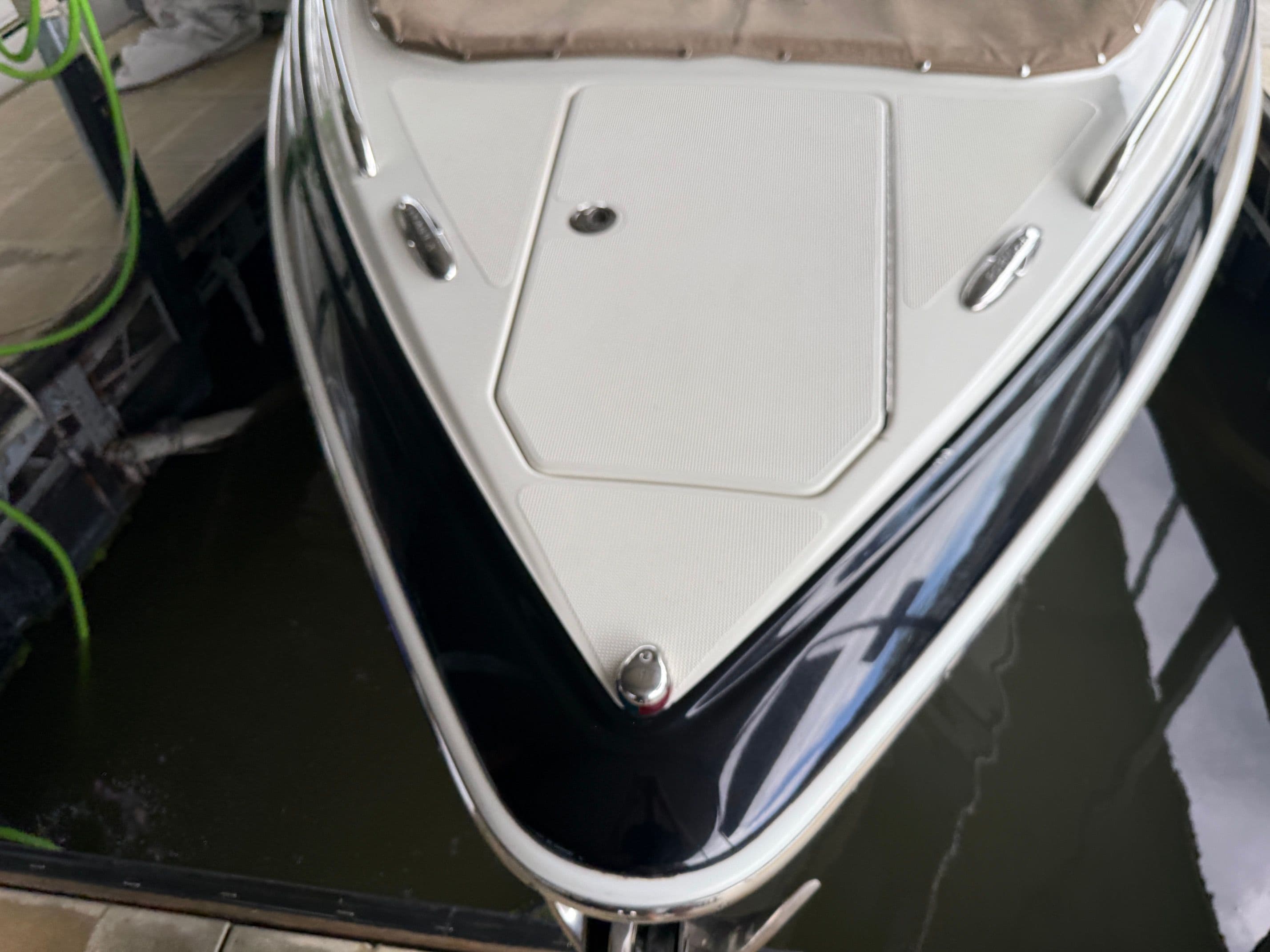 Bow of a 2016 Formula 310 BR boat in water.