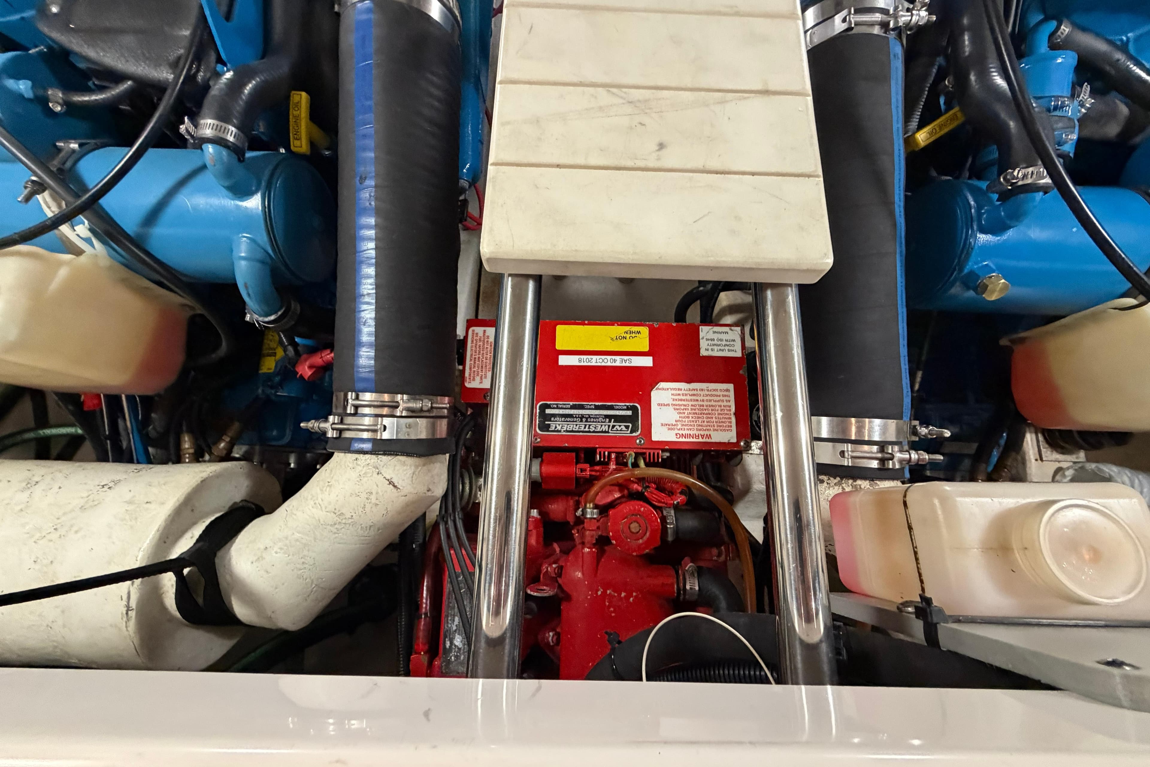 Engine compartment of a 2004 Tiara Yachts 3200 Open, showcasing mechanical components.