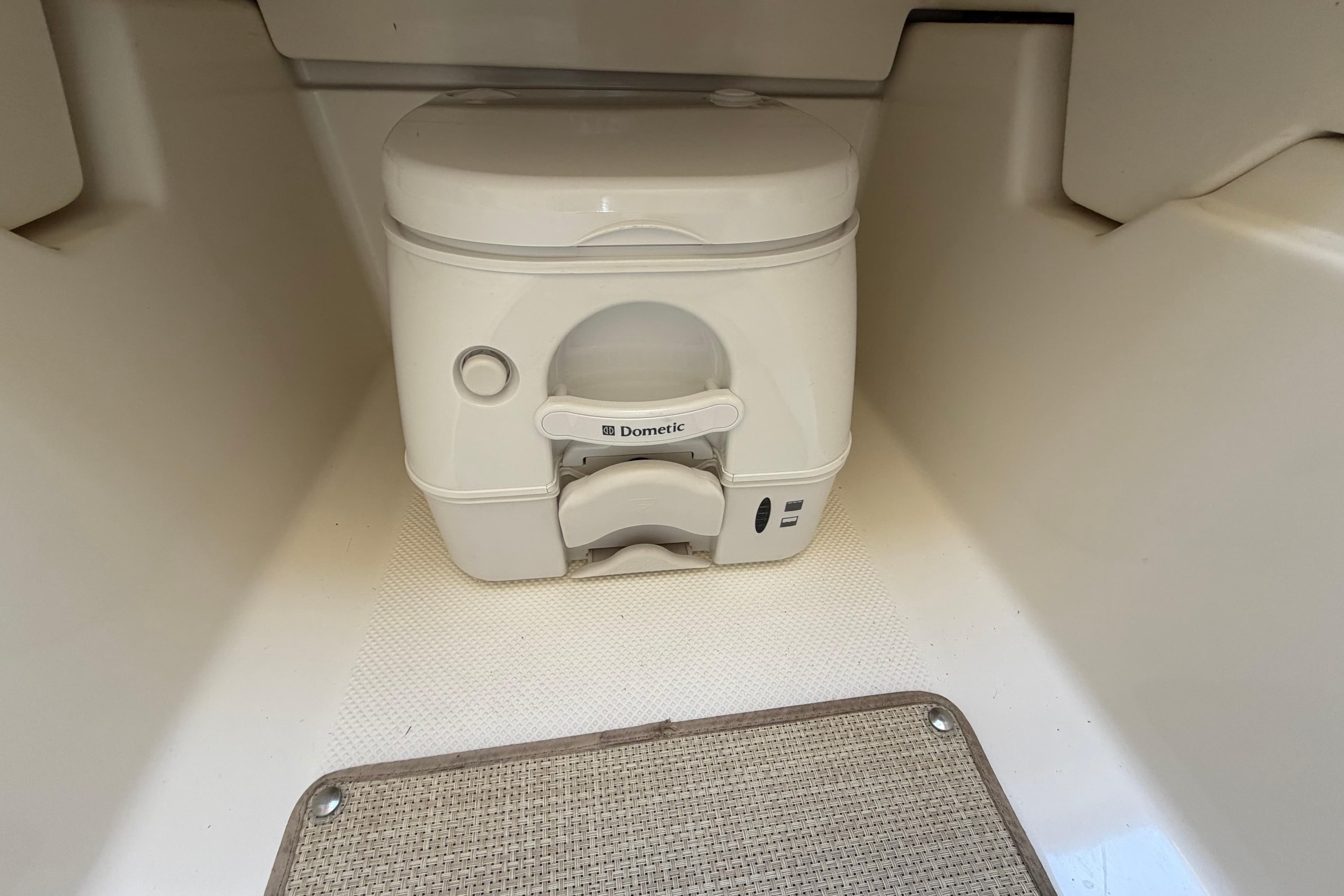 Portable toilet inside 2016 Bayliner 742 Cuddy boat cabin.