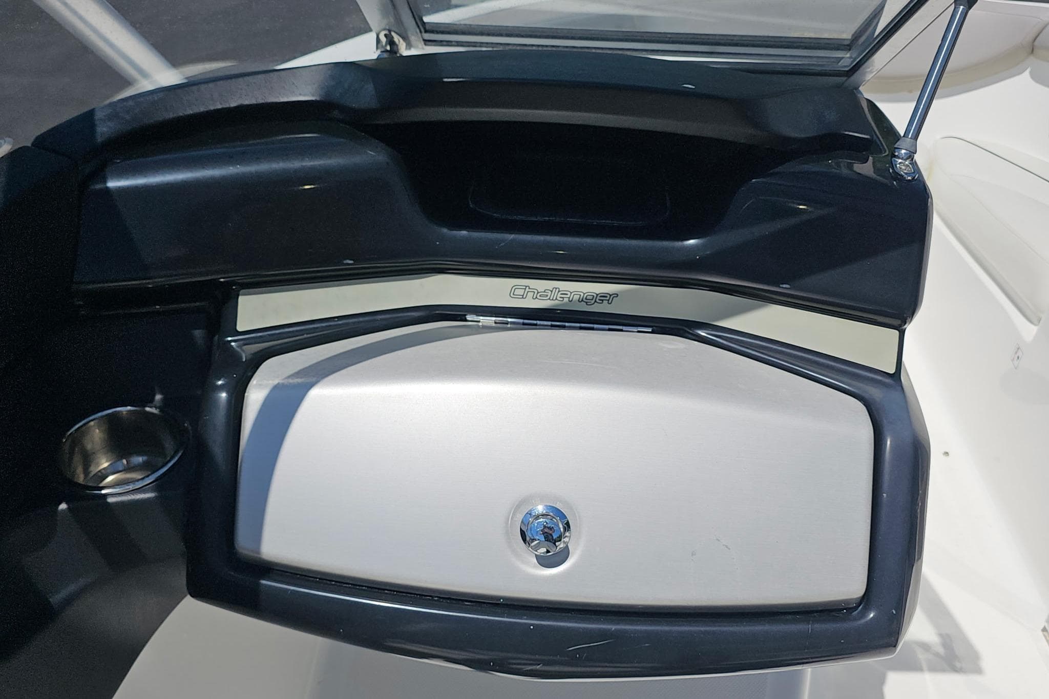 2010 Sea-Doo 210 Challenger SE dashboard with storage compartment and cup holder.