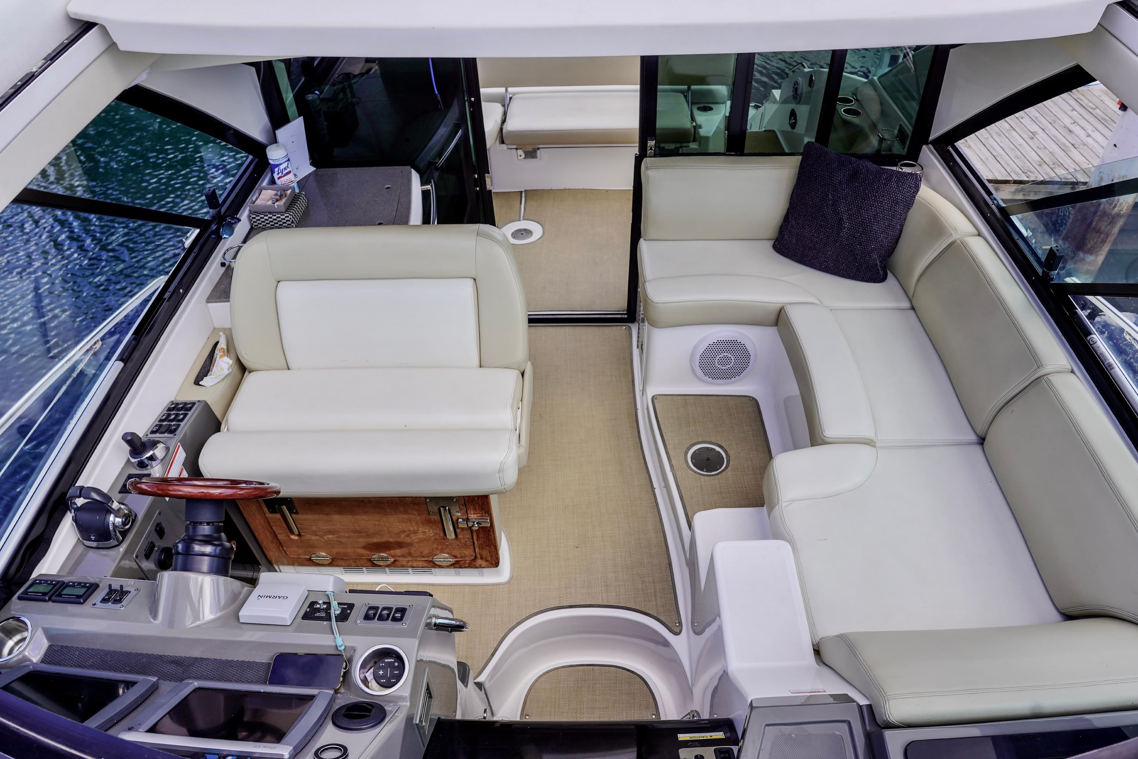 Luxurious interior of 2012 Regal 42 Sport Coupe with plush seating and modern helm.