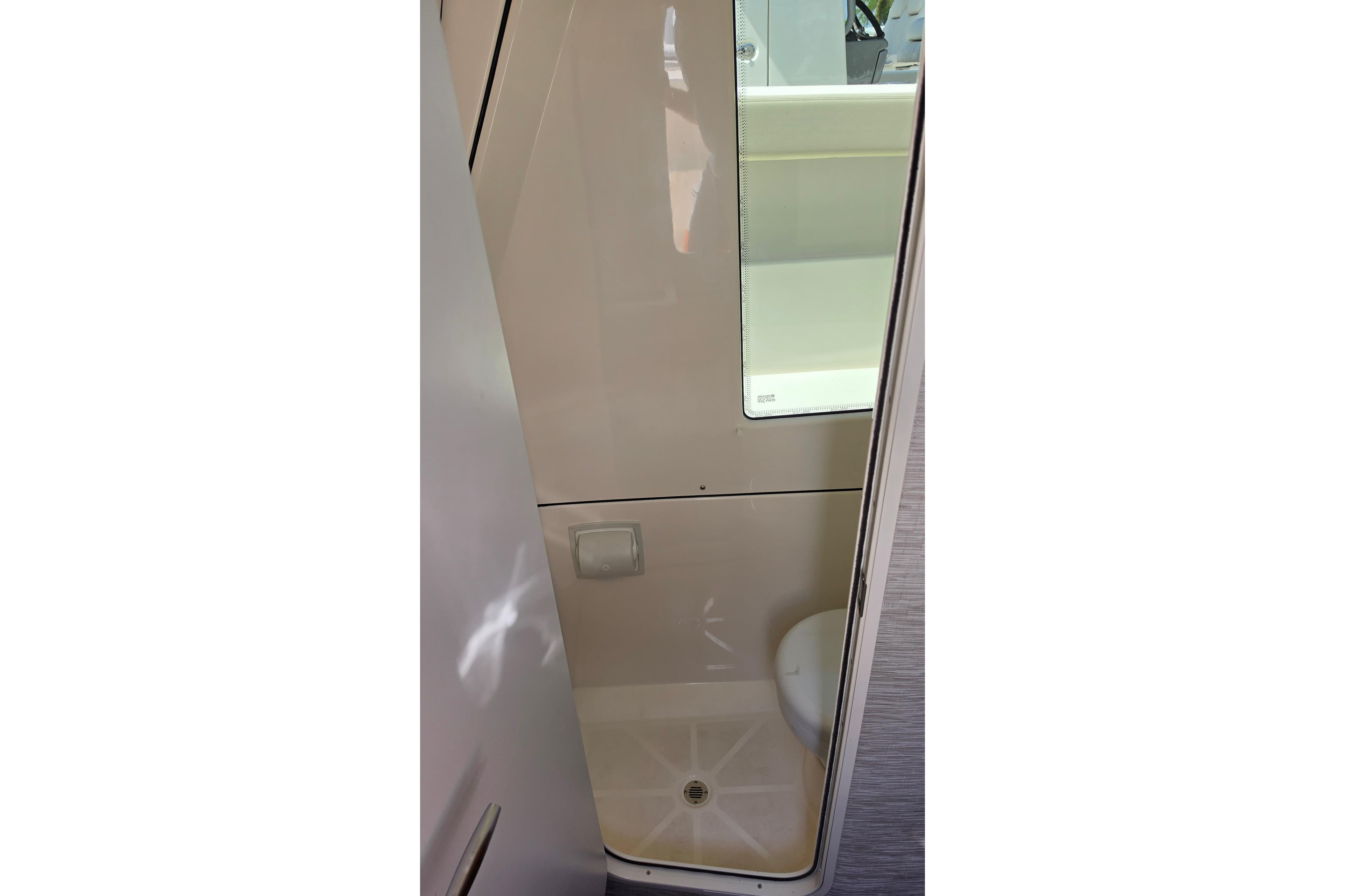 Interior view of 2025 Solace 37CS boat bathroom with modern design and compact layout.