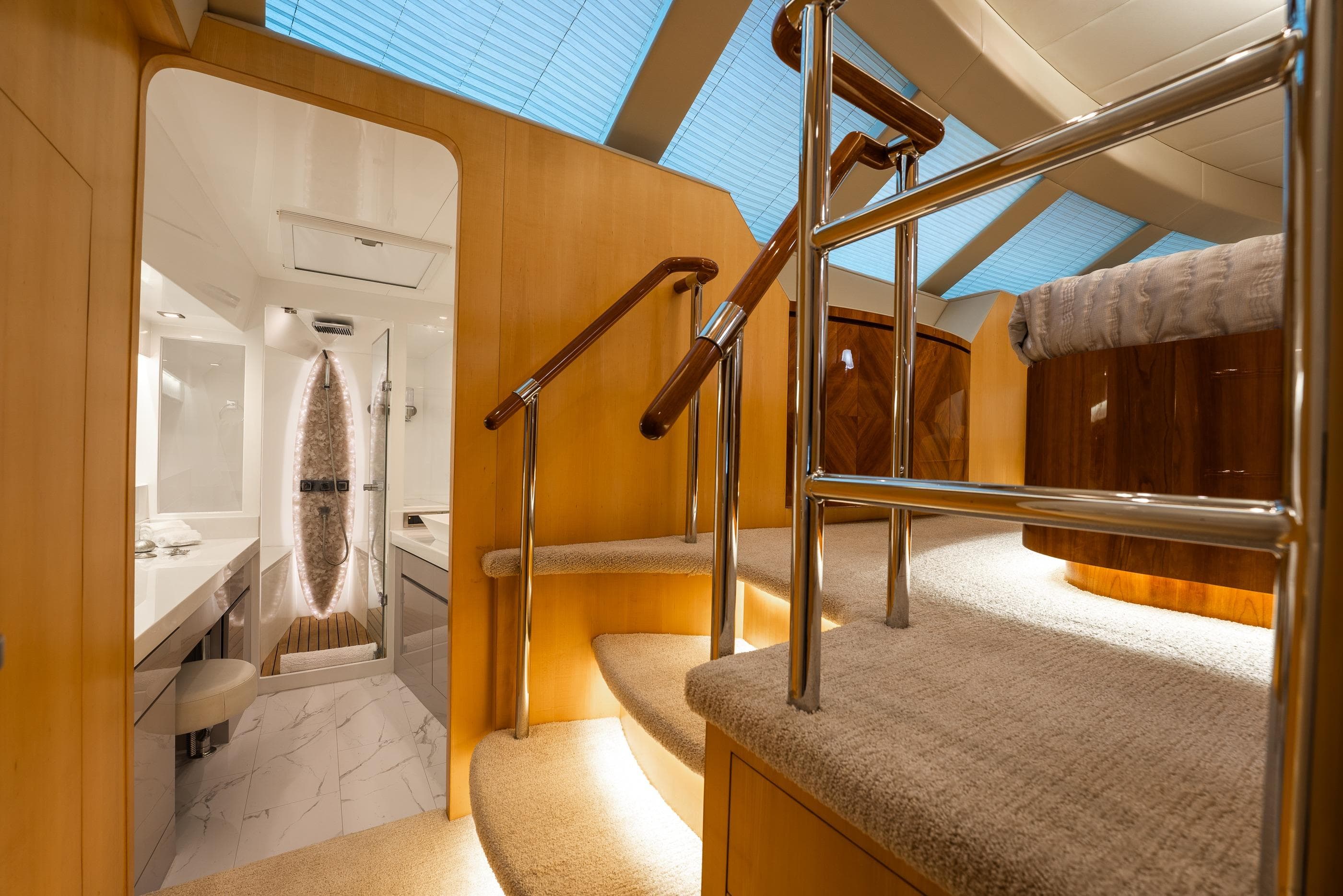 Luxurious interior of 2013 Horizon PC60 yacht with elegant staircase and modern bathroom.