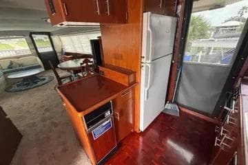 1989 Ocean 48 Motor Yacht interior with kitchen and dining area.