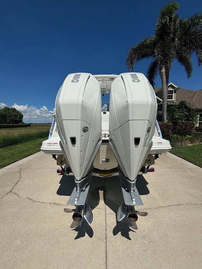Rear view of 2021 Blackfin 272 DC with twin outboard engines.
