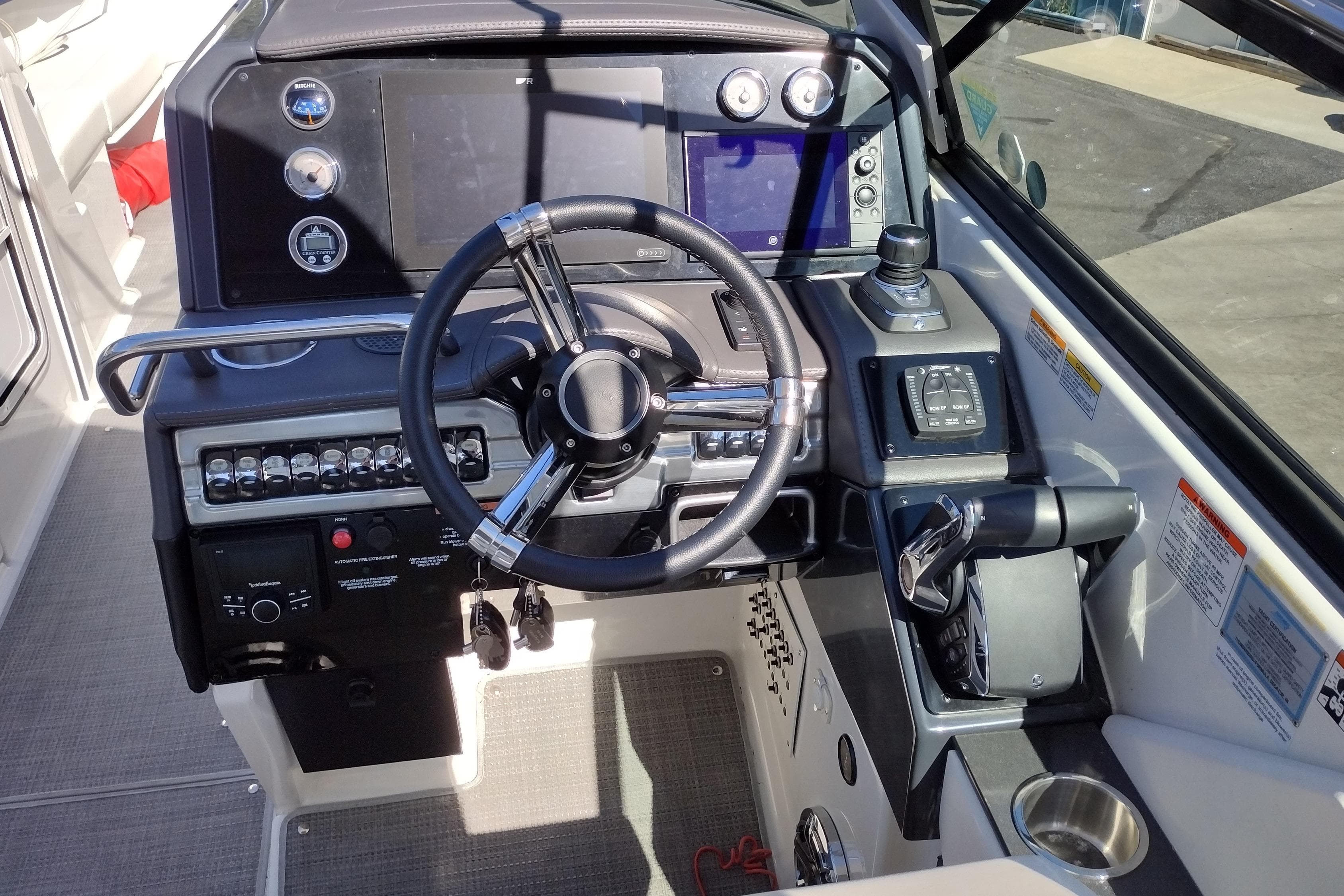 Cockpit of 2022 Formula 310 Bowrider with steering wheel and control panel.