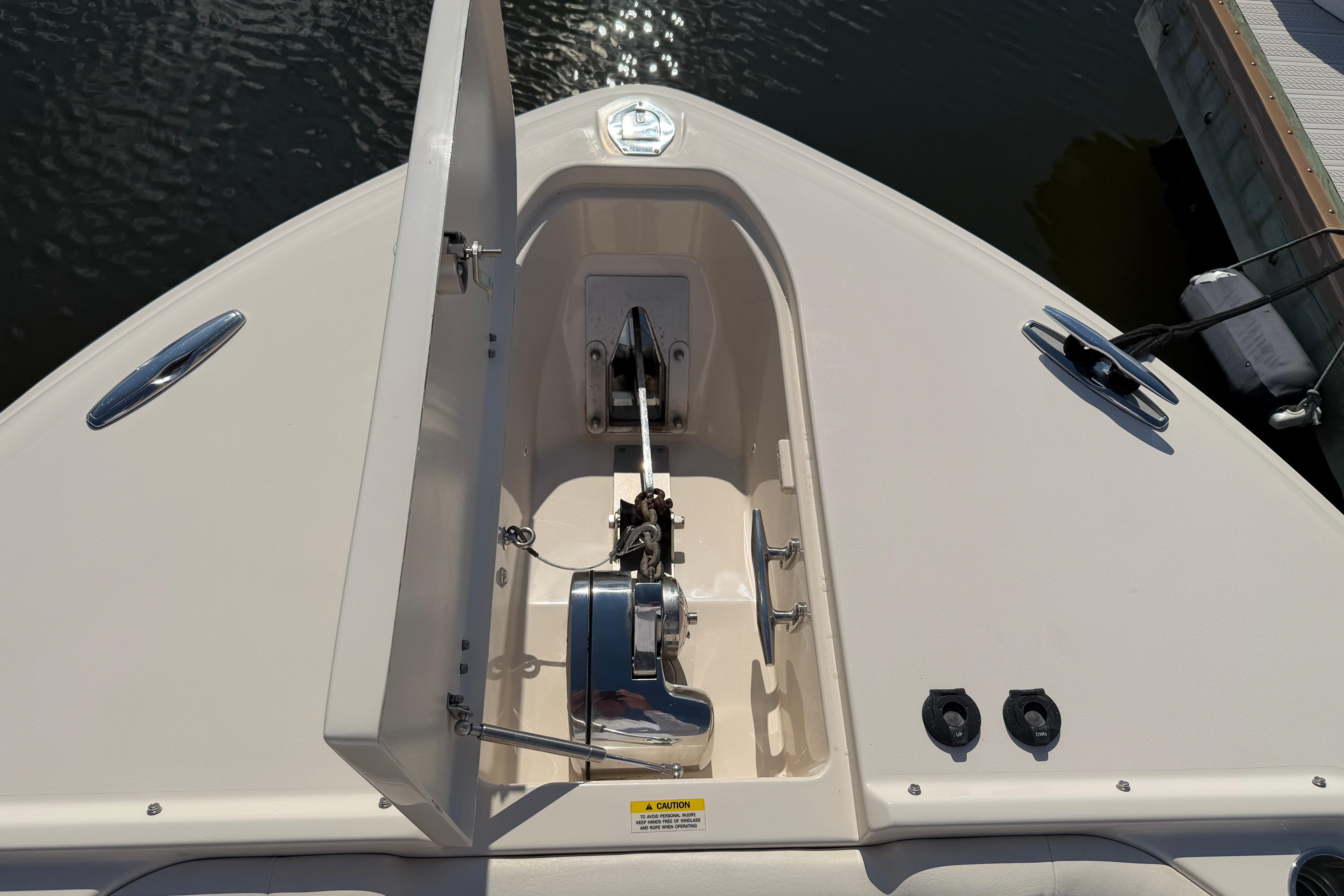 2017 Grady-White Freedom 335 boat anchor compartment, open hatch, dockside view.