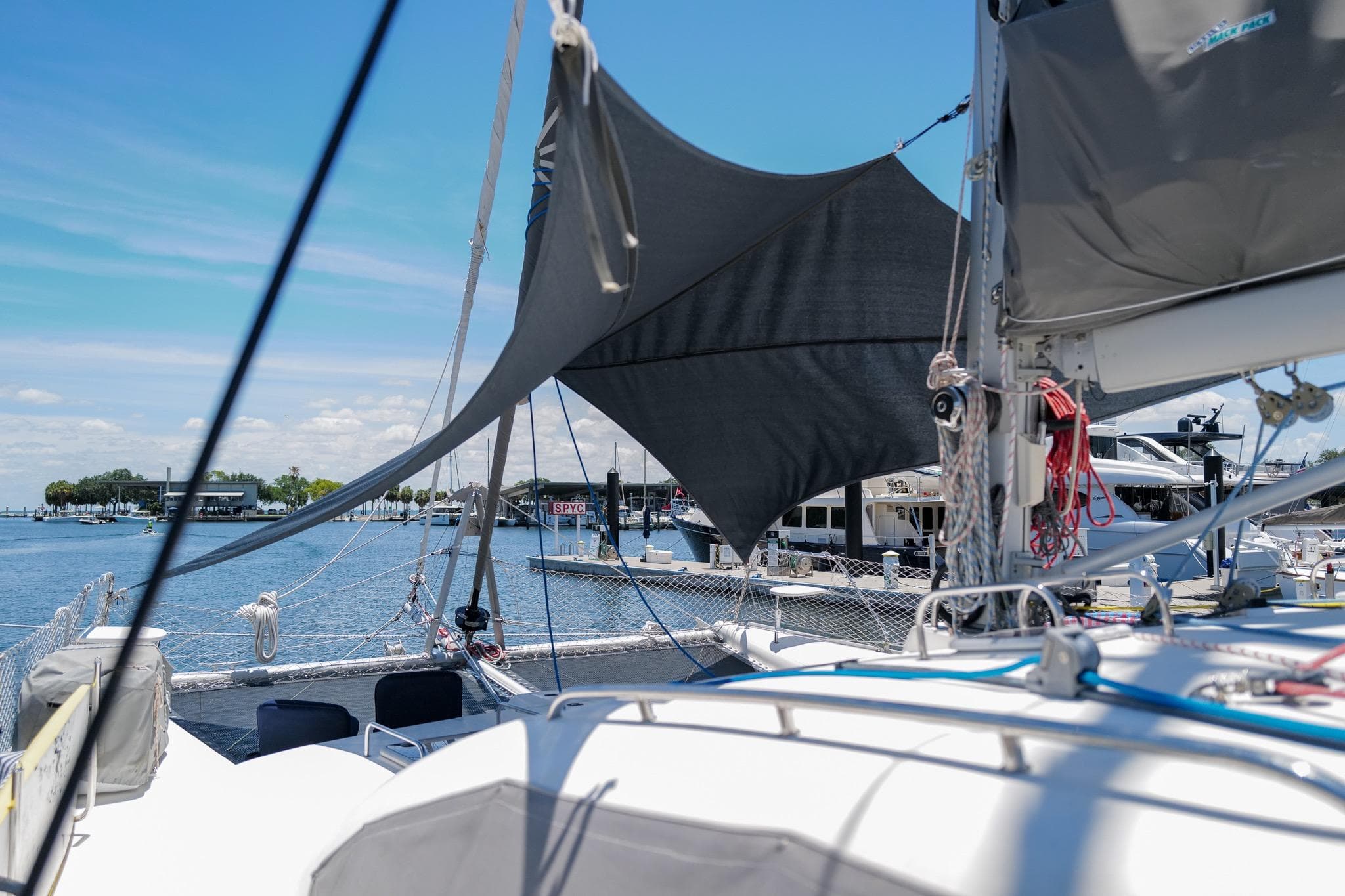 Sailboat Leopard 43, 2006 model, docked at marina with clear blue sky.