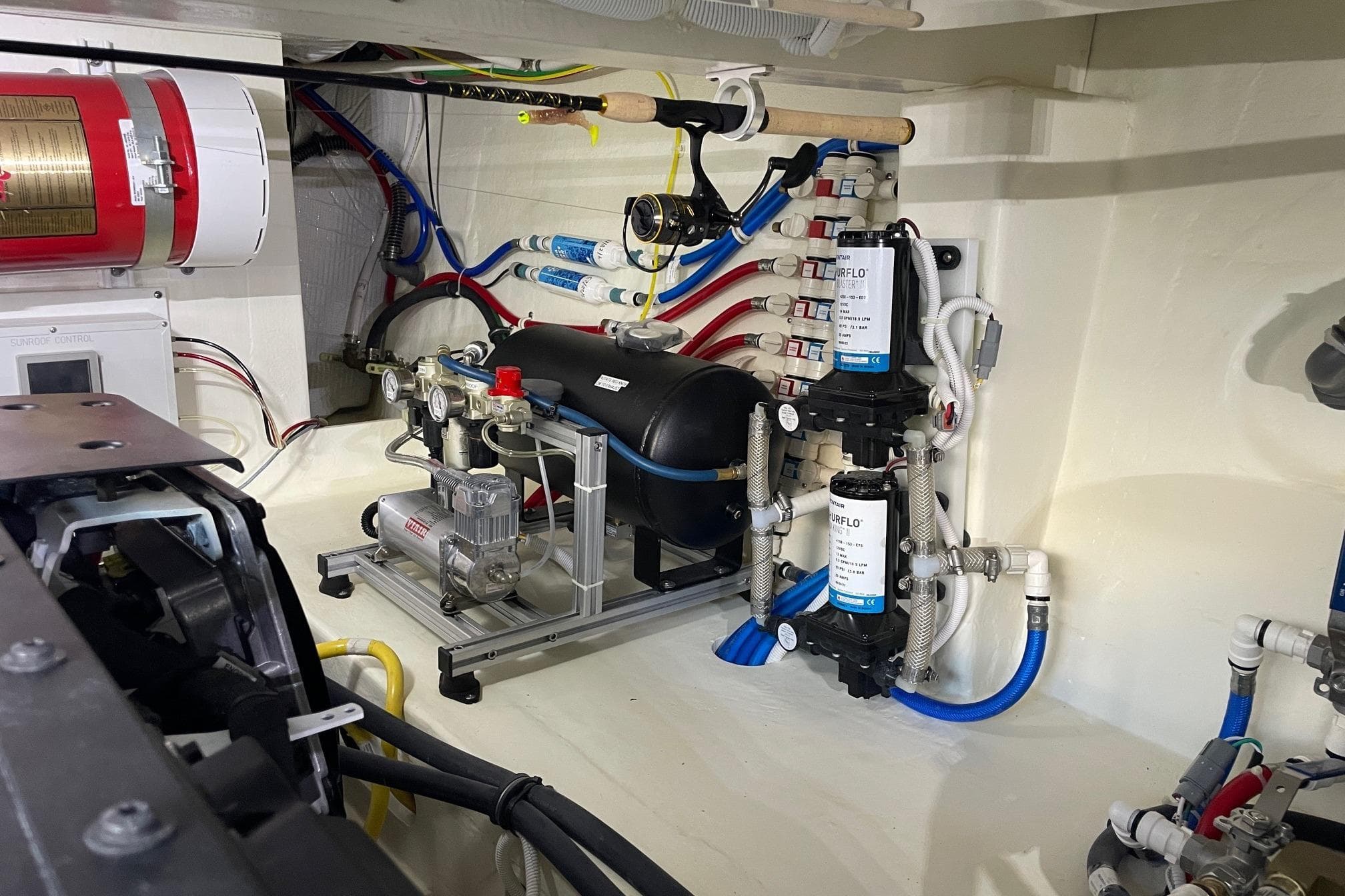 Engine room of 2023 Tiara Yachts C44 Coupe, showcasing mechanical systems and components.