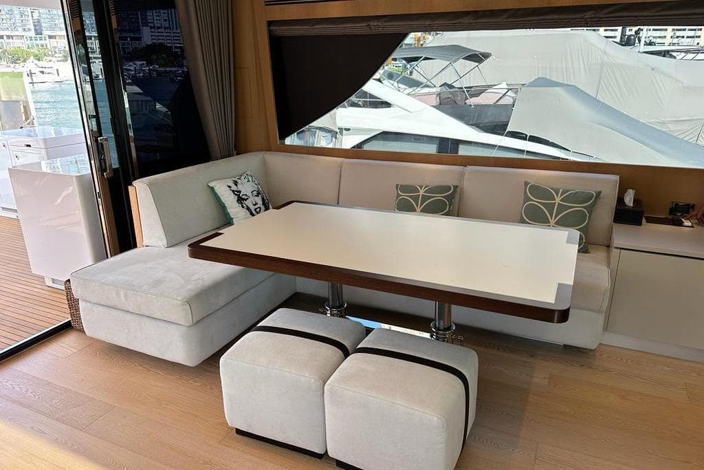 Luxurious interior of 2021 Horizon FD80 yacht with elegant seating and table.