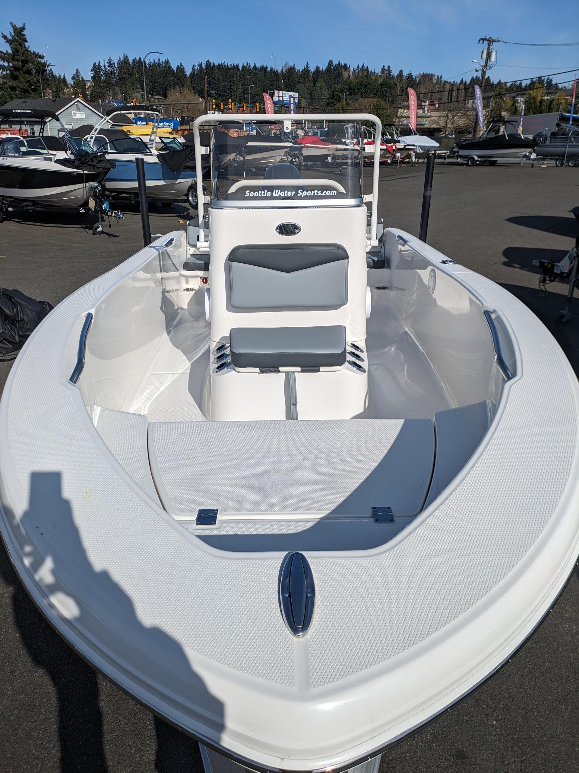 2025 Robalo R160 boat displayed outdoors, showcasing sleek design and spacious seating.