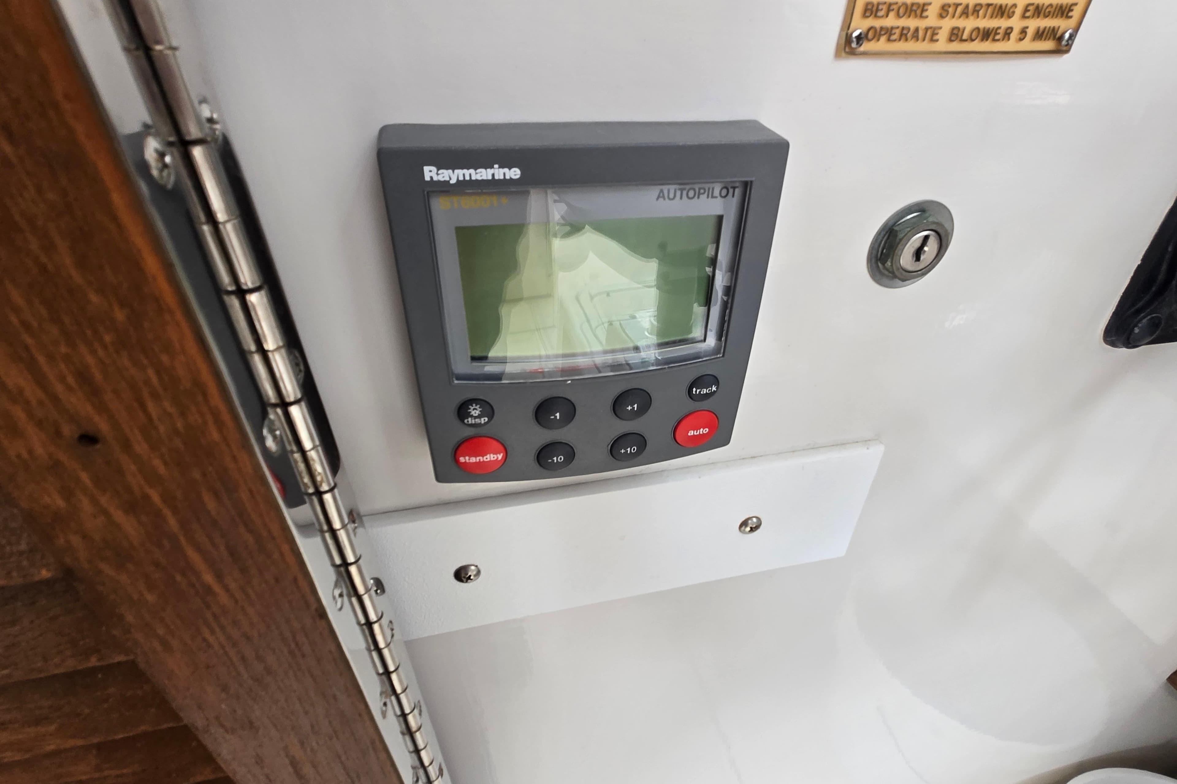 Raymarine autopilot system on 1989 Sea Ox 250C boat dashboard.