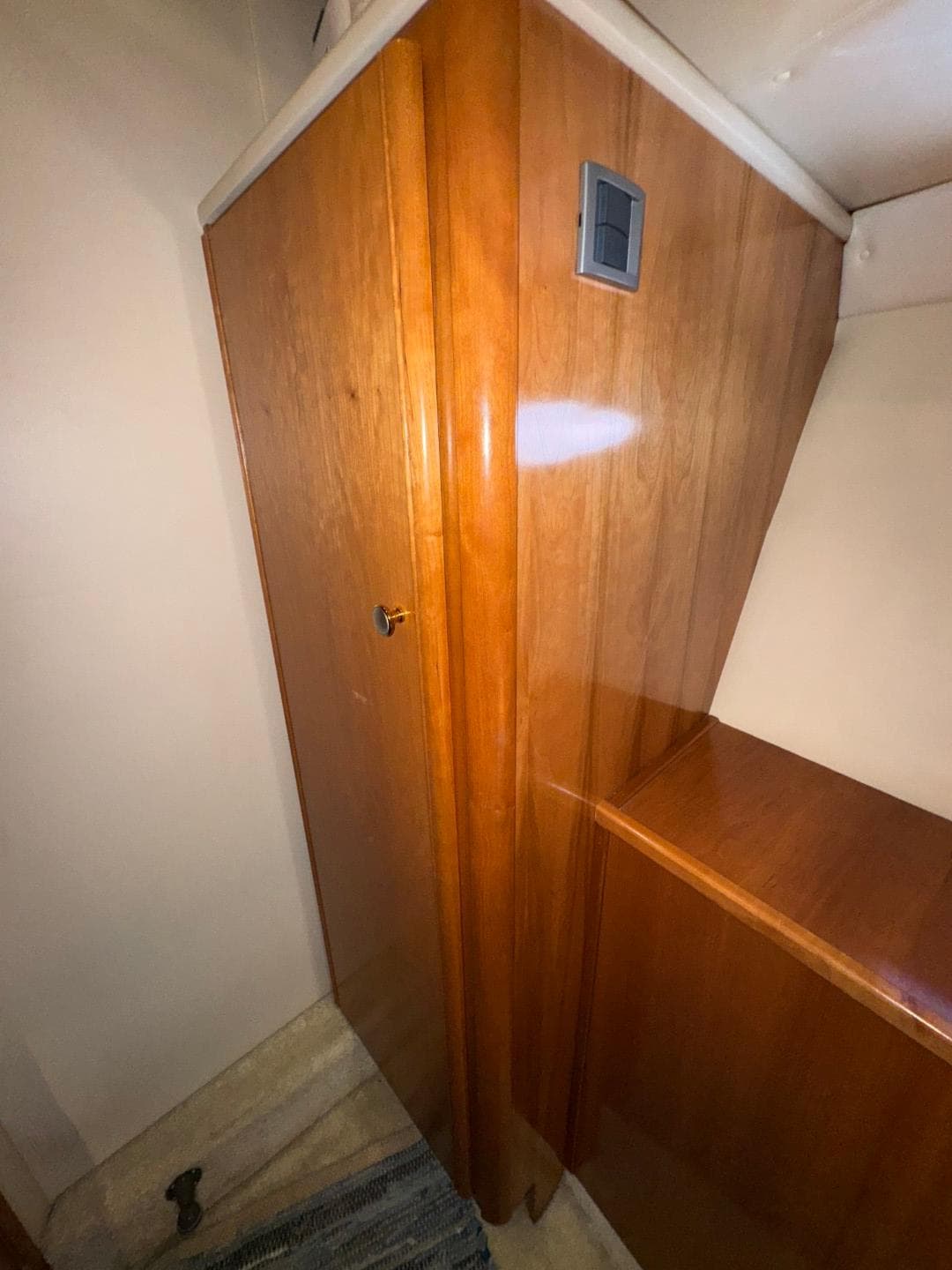 Wooden interior of 2003 Meridian 381 Sedan yacht, featuring sleek cabinetry and modern design.