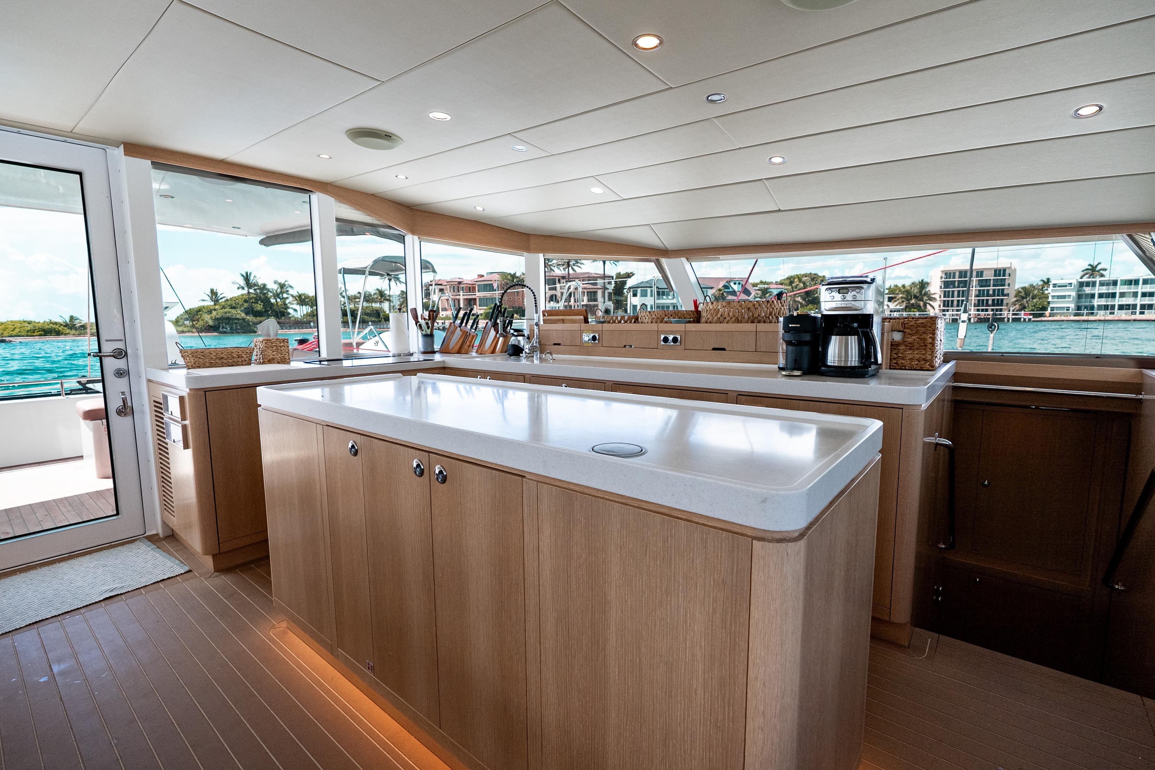 Luxurious Ocean Explorer Catamarans interior with modern kitchen and scenic ocean view.