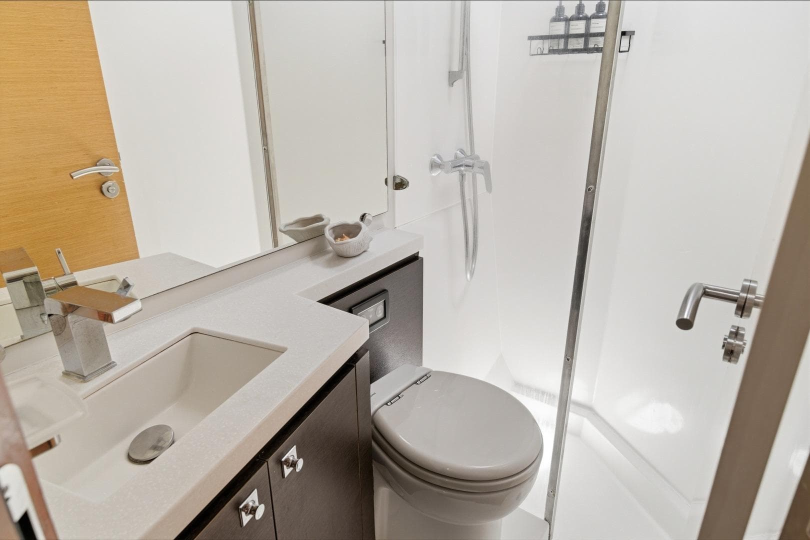 Modern bathroom in 2013 Fountaine Pajot Sanya 57 yacht with shower and sleek fixtures.
