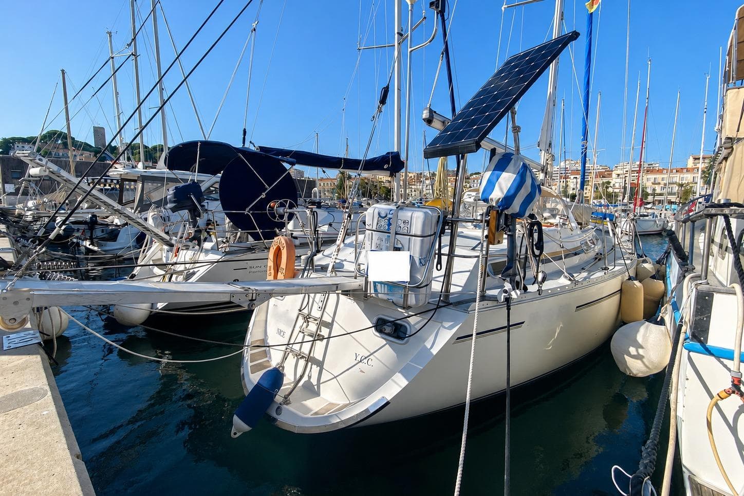 Sailboat Moody 376, 1991 model, docked in a marina with solar panel.