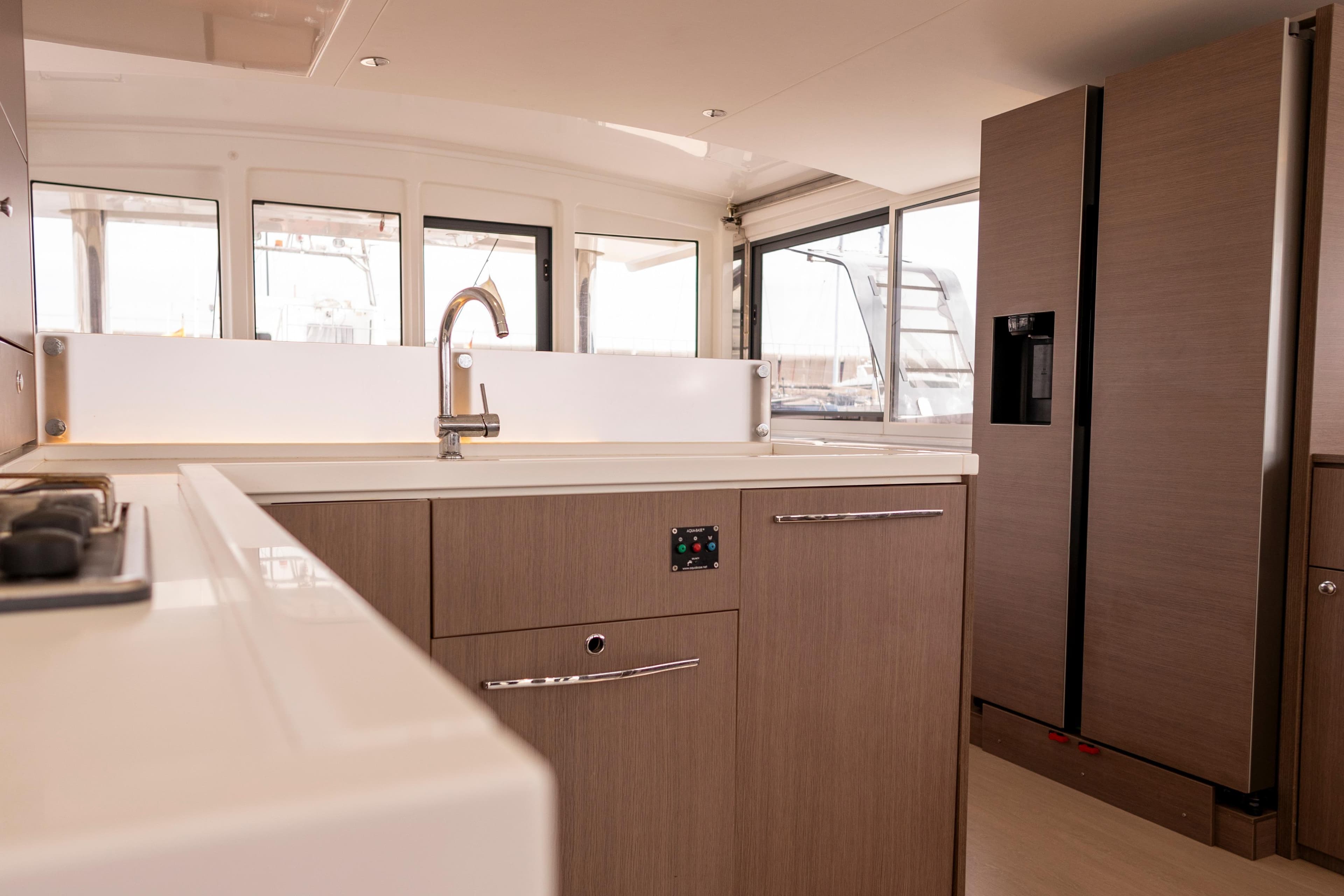 Modern kitchen interior on a 2020 Bali 4.8 yacht, featuring sleek cabinetry and appliances.