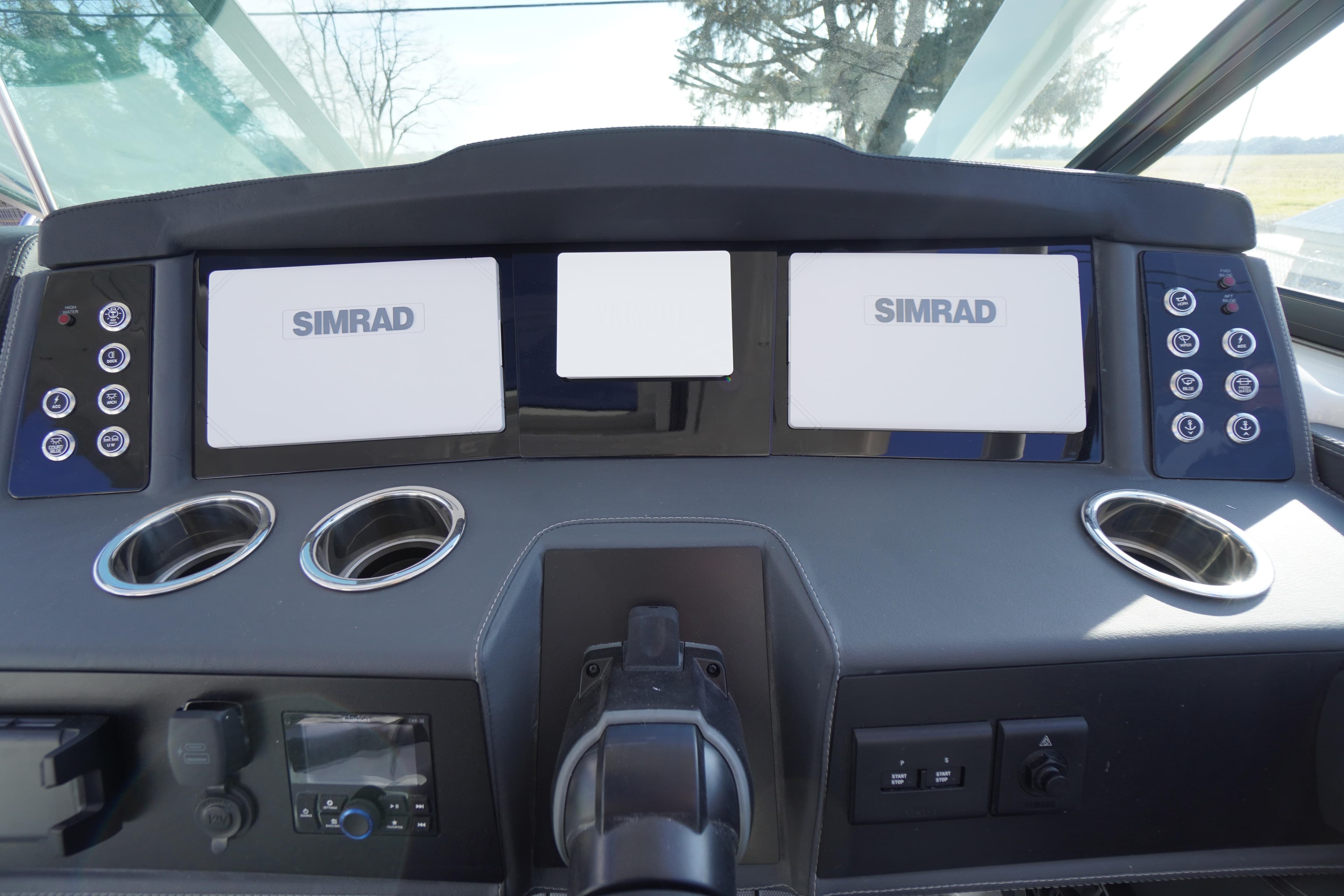 Dashboard of 2026 Chaparral 280 OSX boat with Simrad displays and controls.