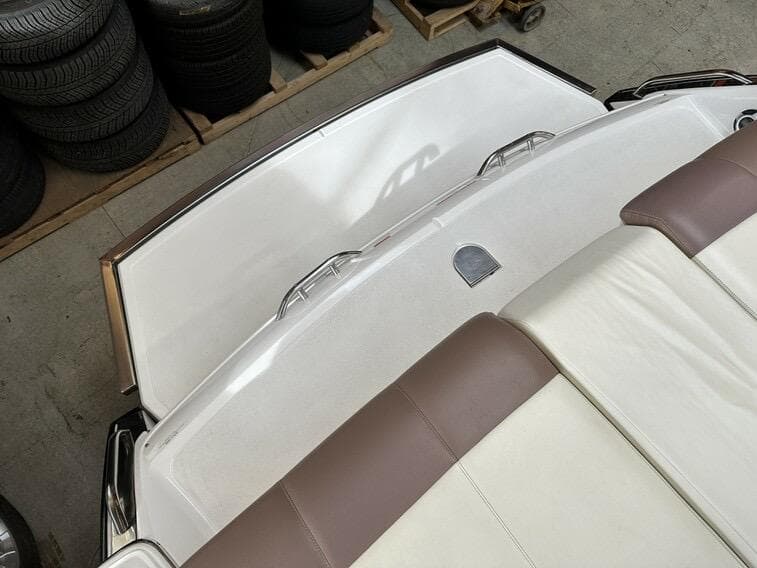 2011 Cobalt 296 boat interior with white and brown seating, viewed from above.