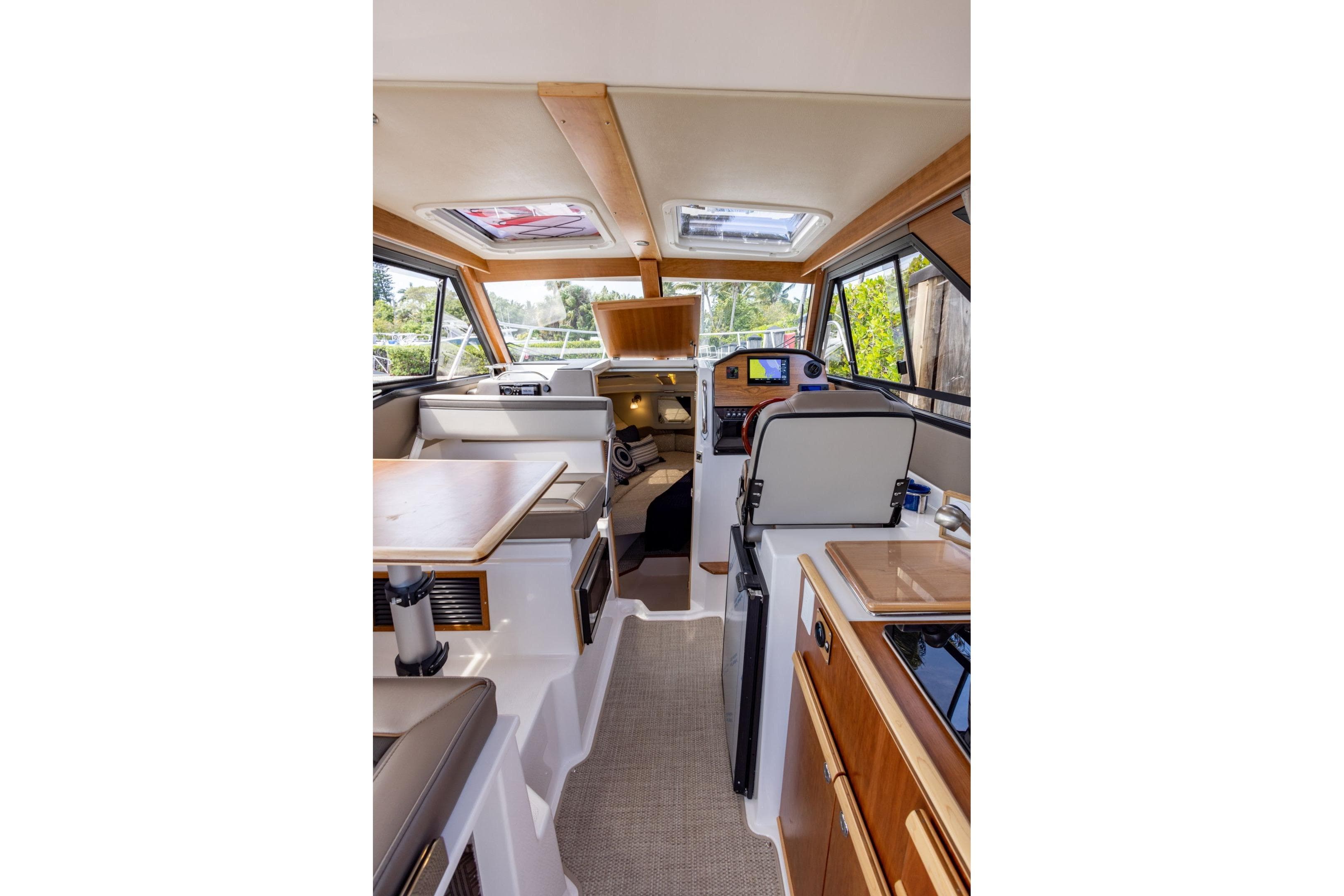 Interior of 2026 Cutwater C-248 Coupe boat, featuring modern design and navigation equipment.
