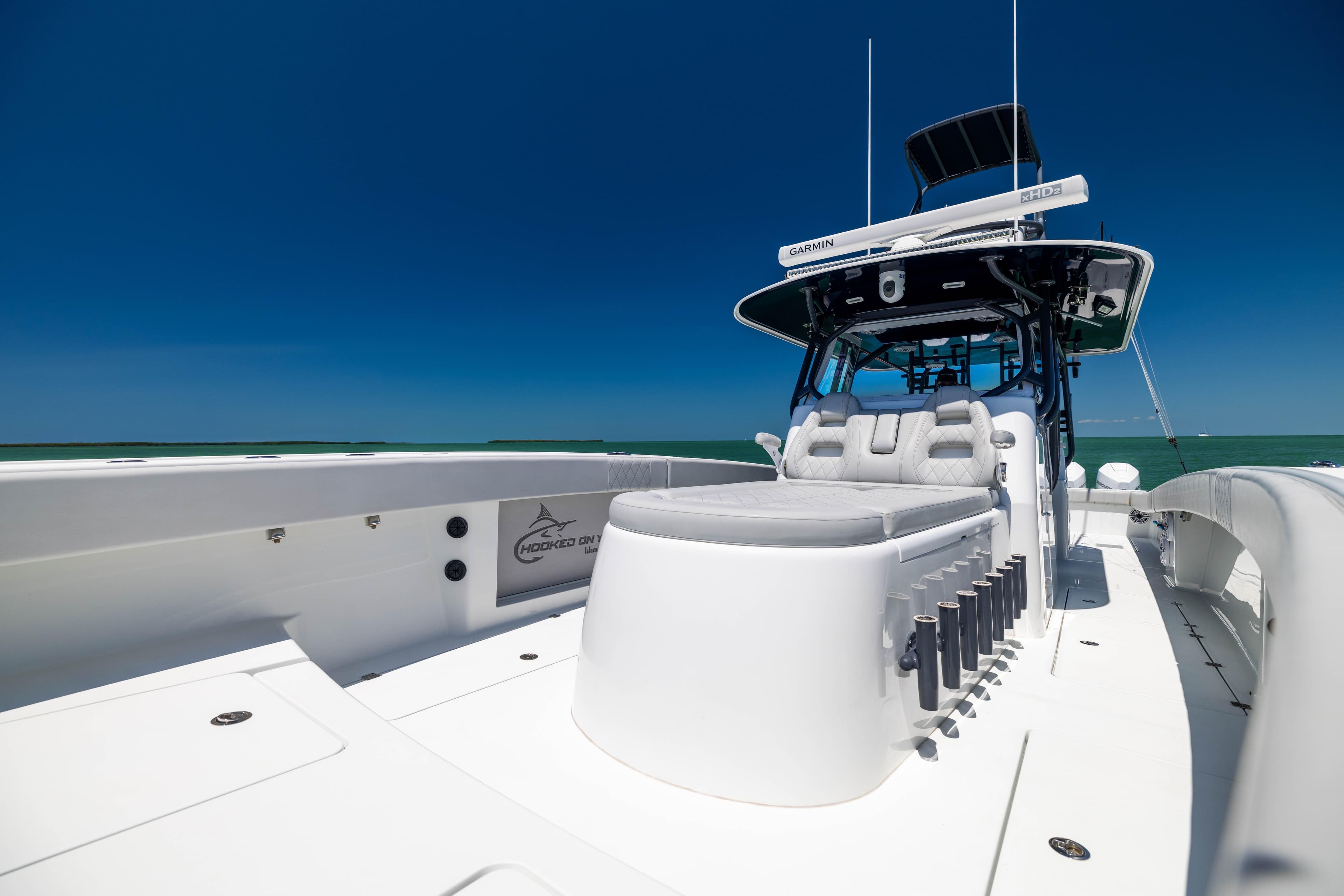 2021 Freeman 42 LR boat with sleek design and spacious deck under clear blue sky.