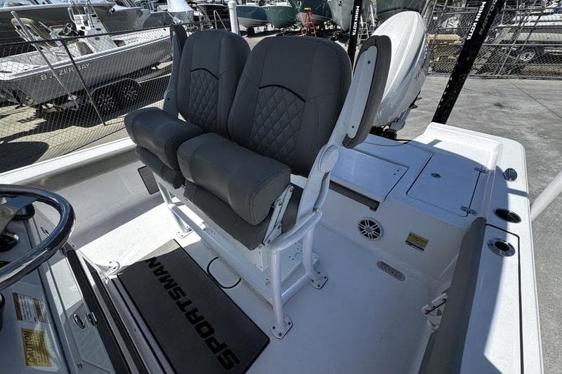 2024 SPORTMAN MASTERS 227 boat interior with dual seats and steering wheel.