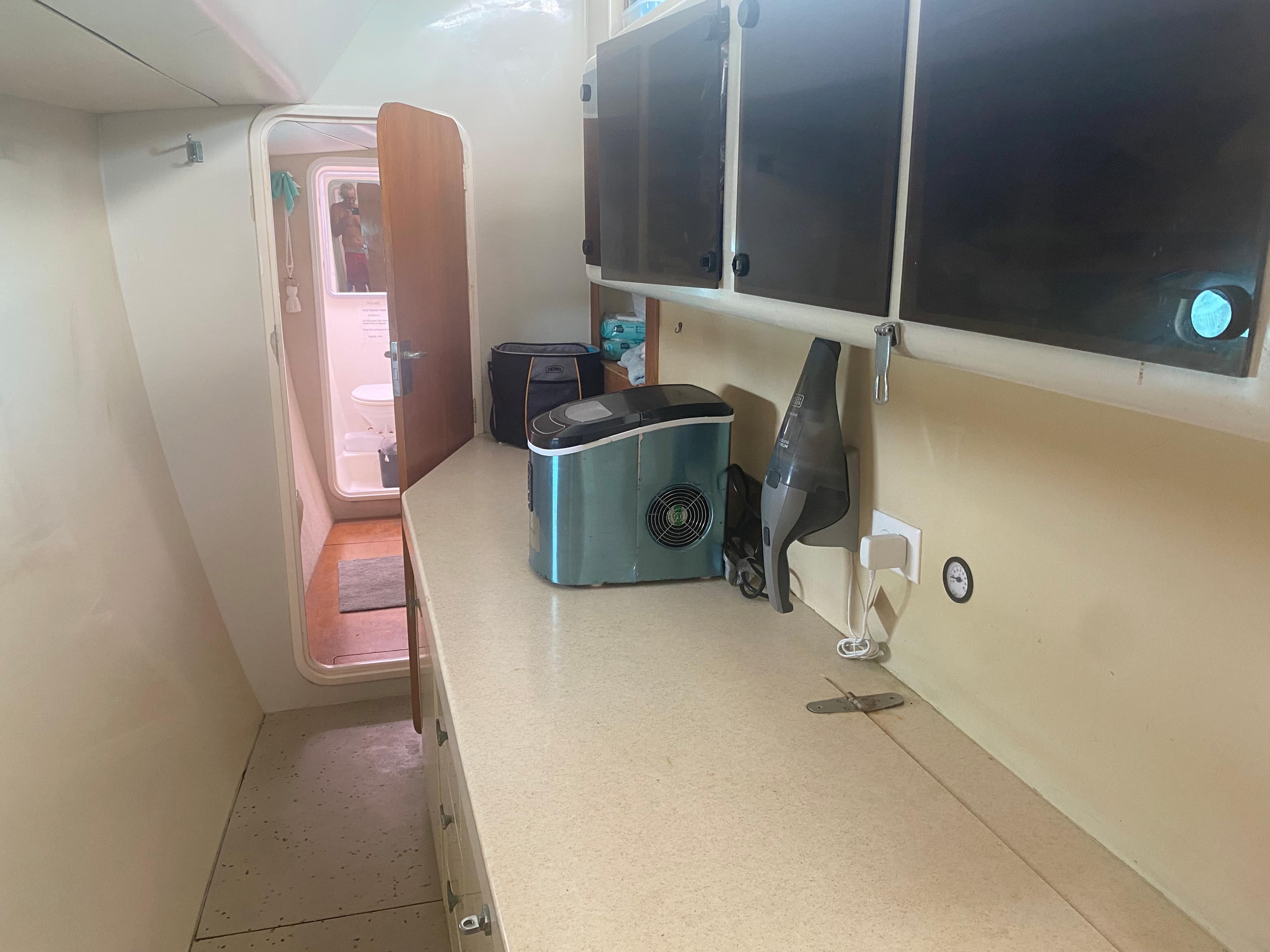 1996 Voyage Mayotte yacht kitchen with appliances and storage cabinets.