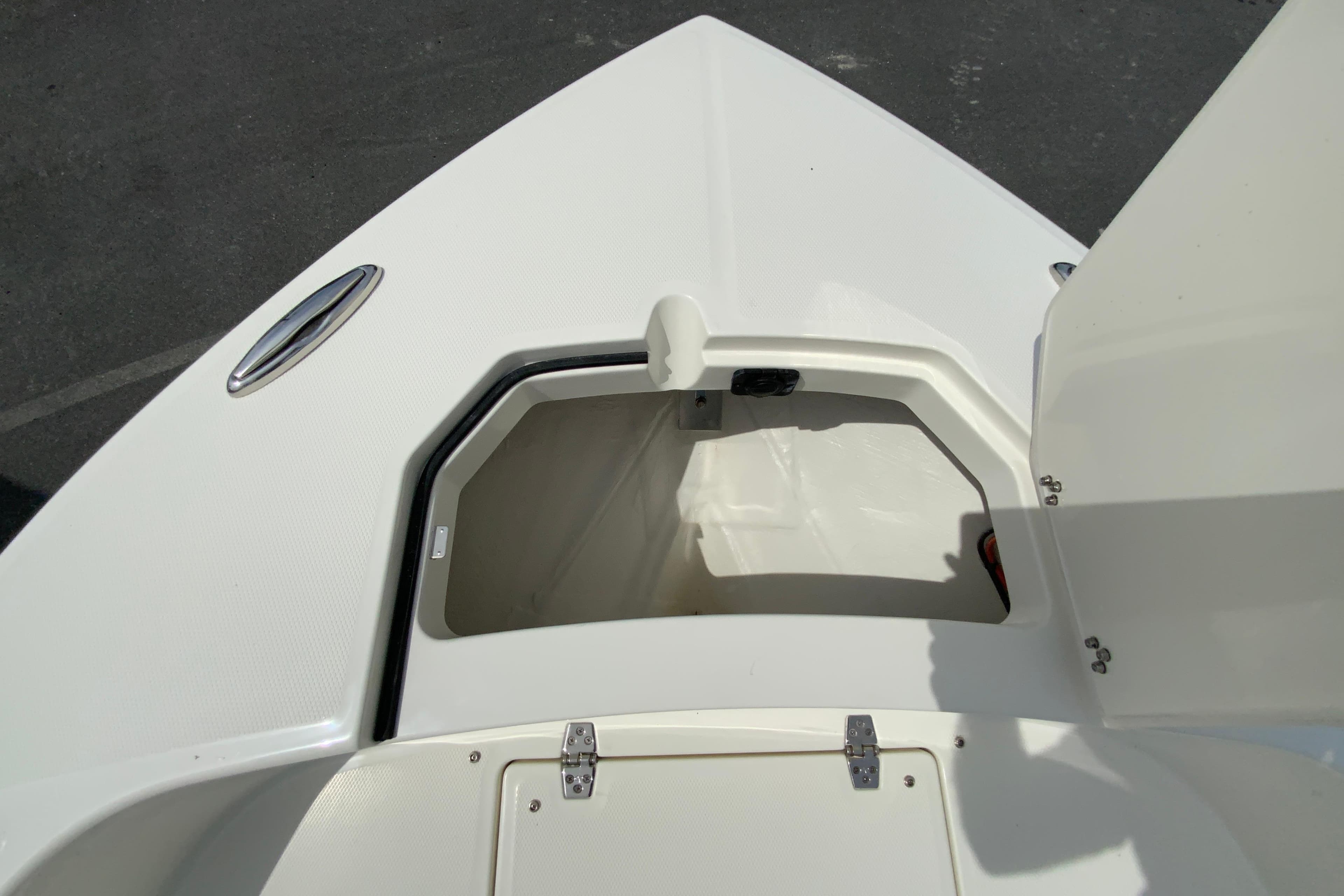 Open storage compartment on 2026 Pathfinder 2600 TRS boat deck.