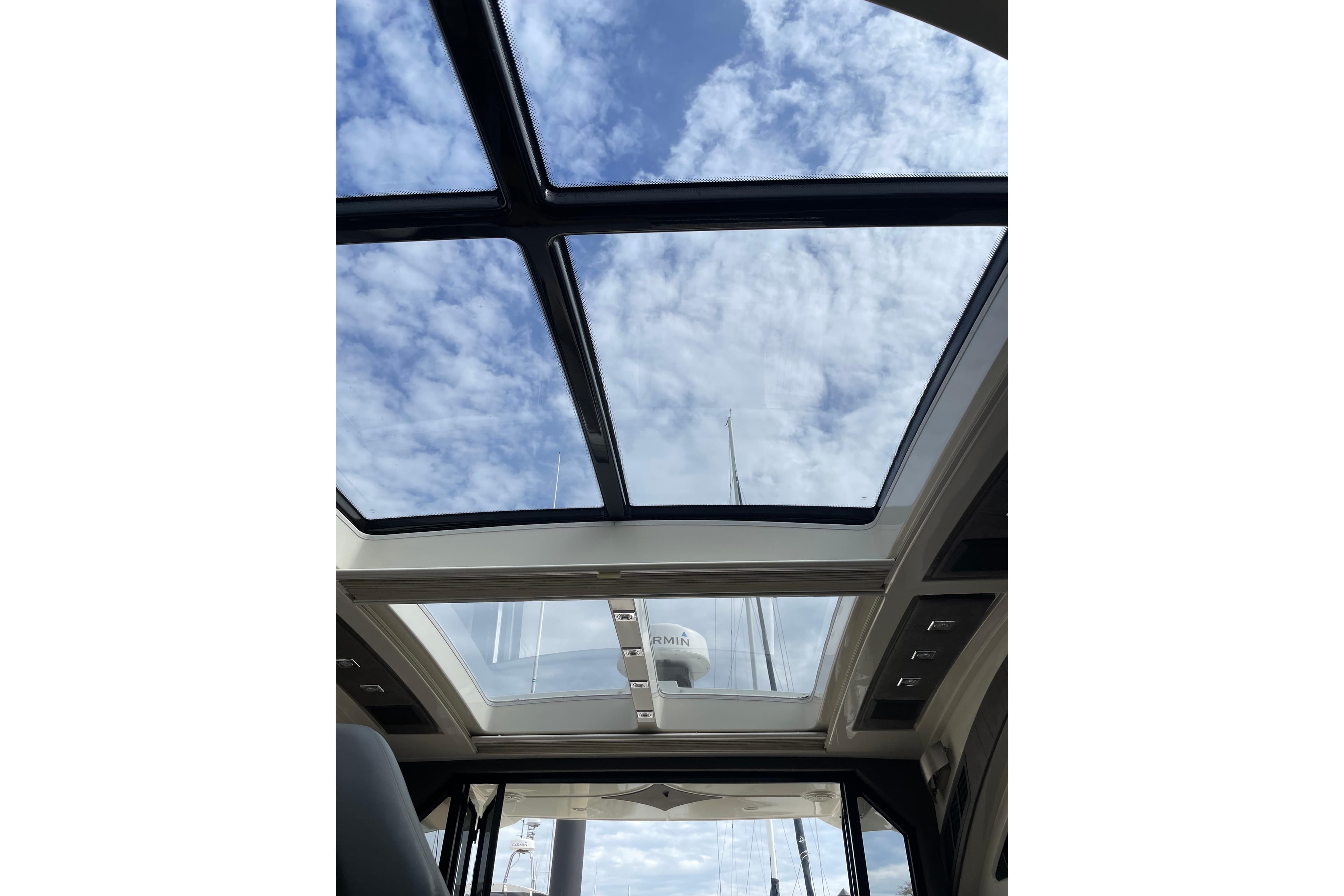 Glass roof of 2008 Marquis 40 SC yacht, showcasing a clear sky view.