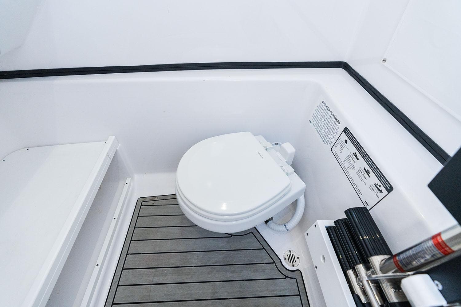 Manufacturer Provided Image: 2025 Sportsman Open 282 Center Console boat interior with marine toilet.