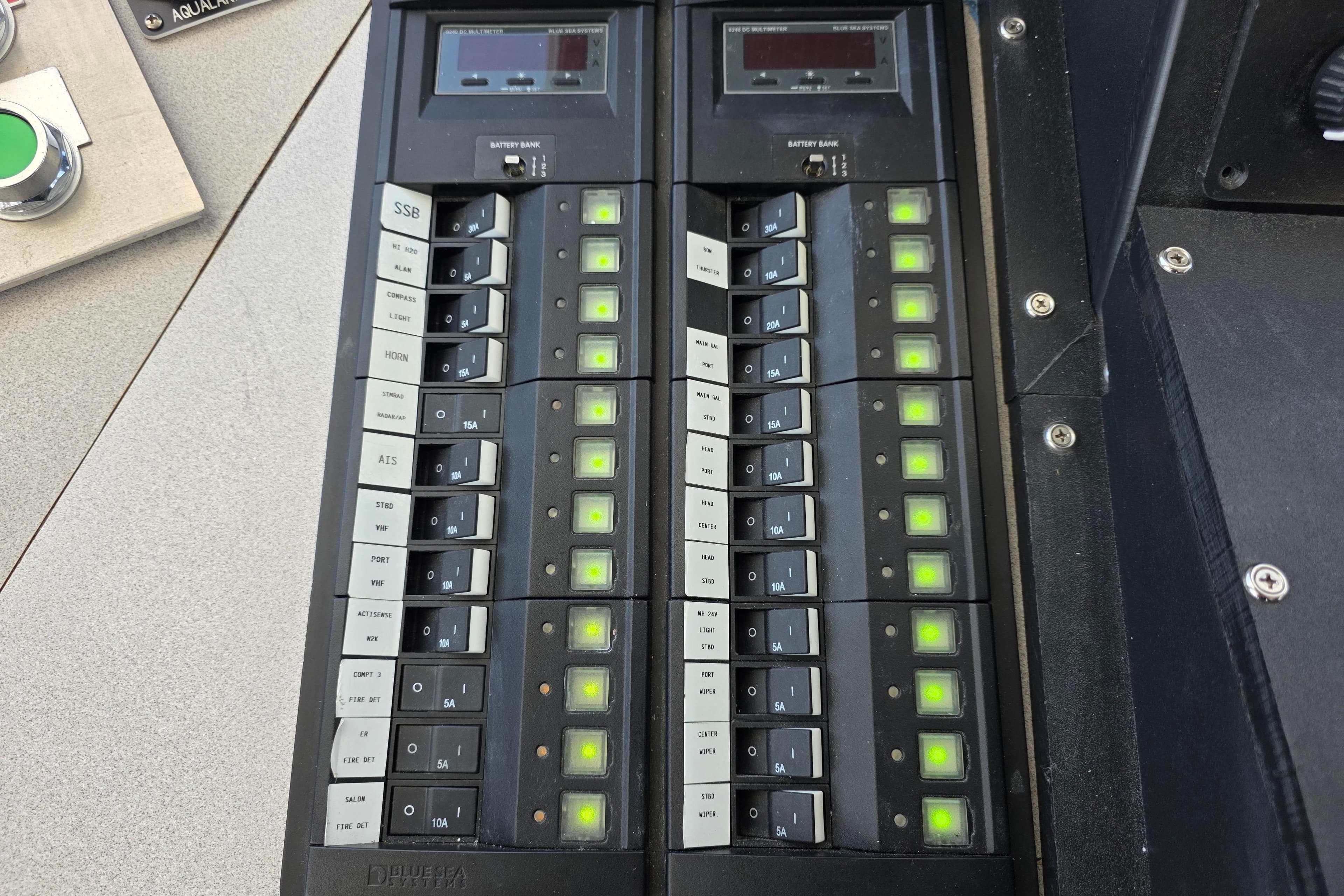 Control panel of a 1986 Gulf Craft Passenger boat with illuminated switches and indicators.