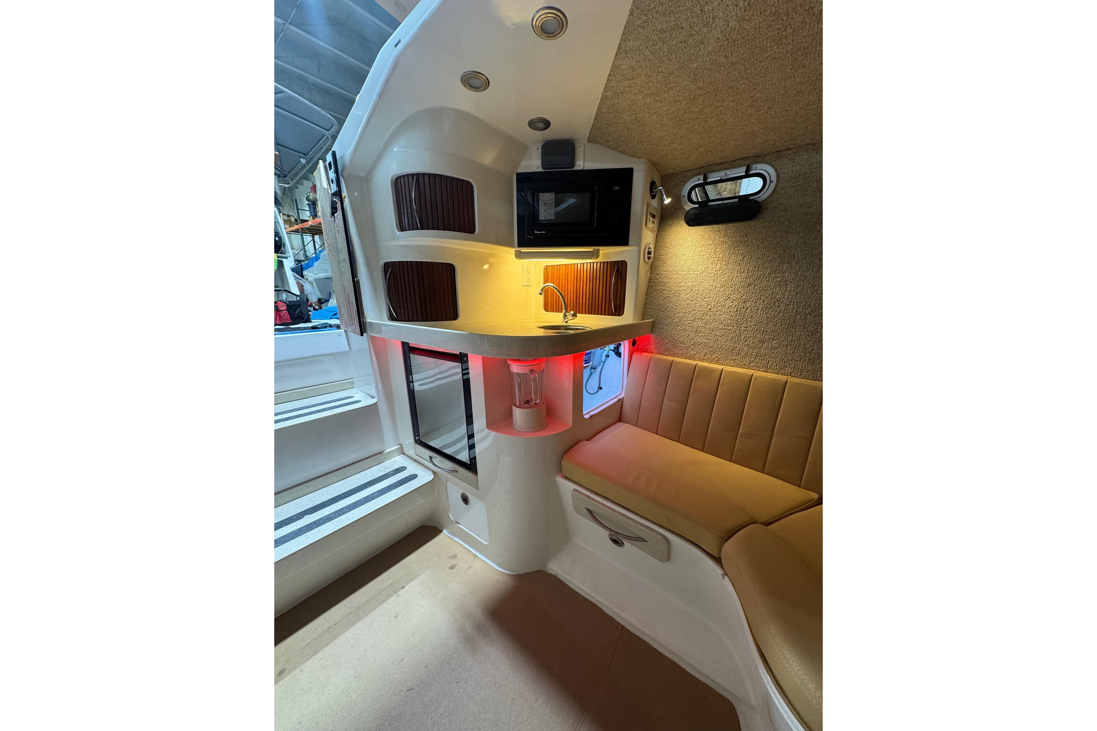 Interior of 2008 Don Smith 45 boat with seating, kitchenette, and ambient lighting.