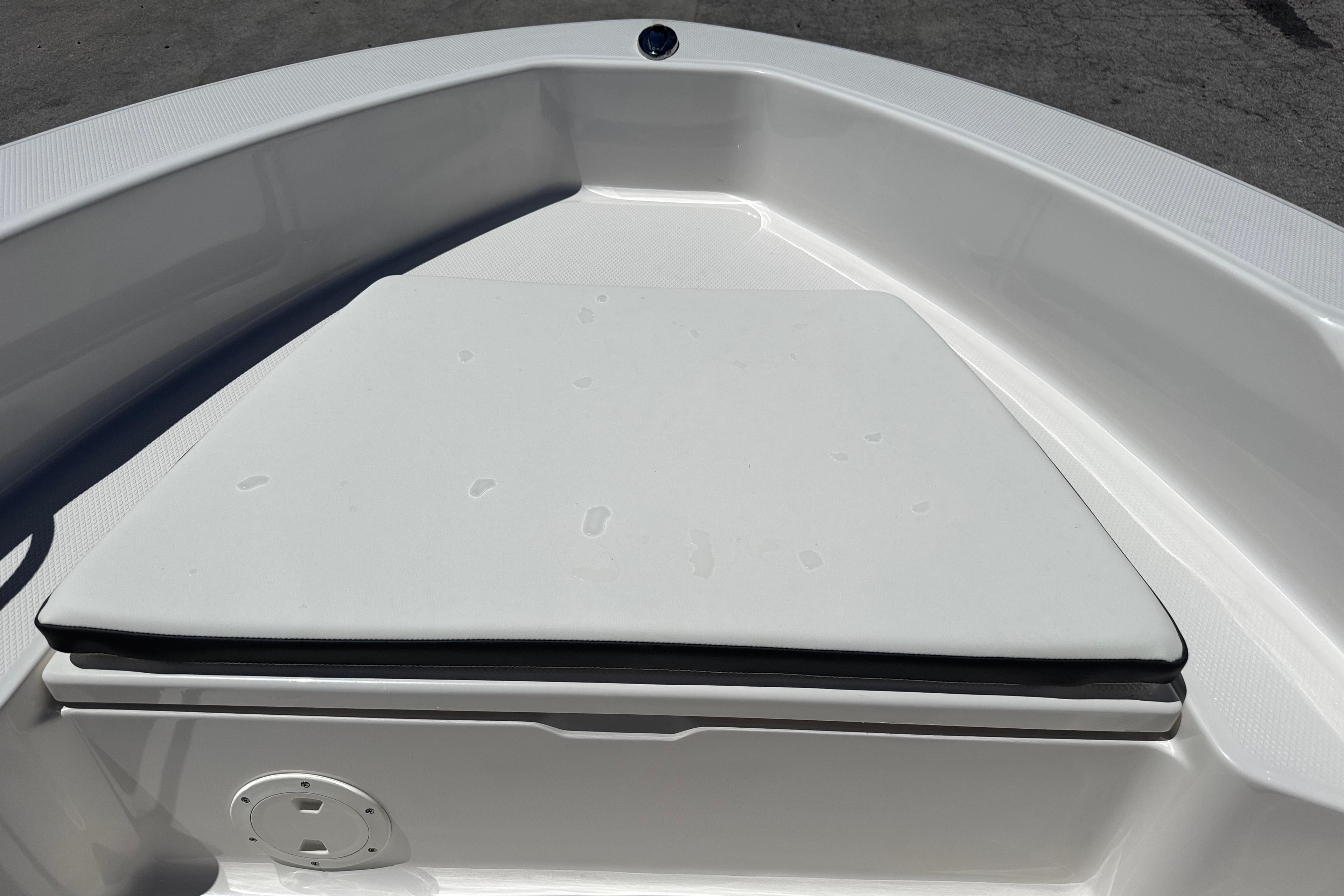 2025 Robalo R160 Center Console boat bow with cushioned seating.