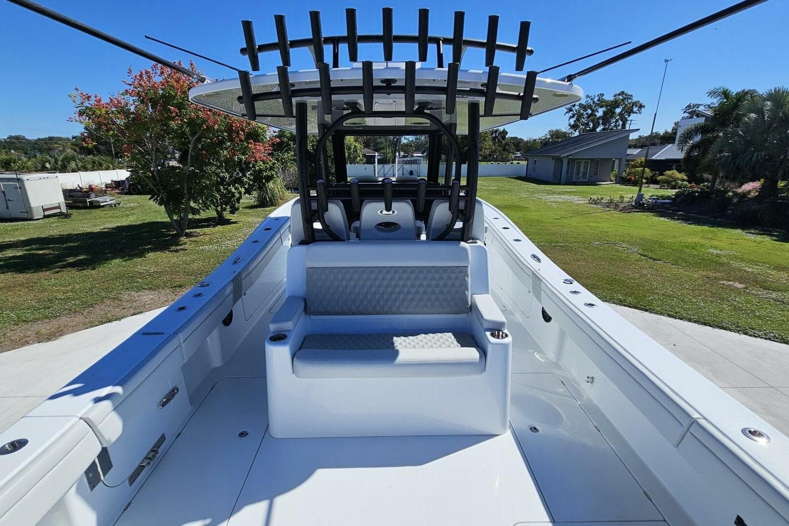 2025 Costa Custom Boats 34ST, spacious deck with seating, rod holders, and sleek design.