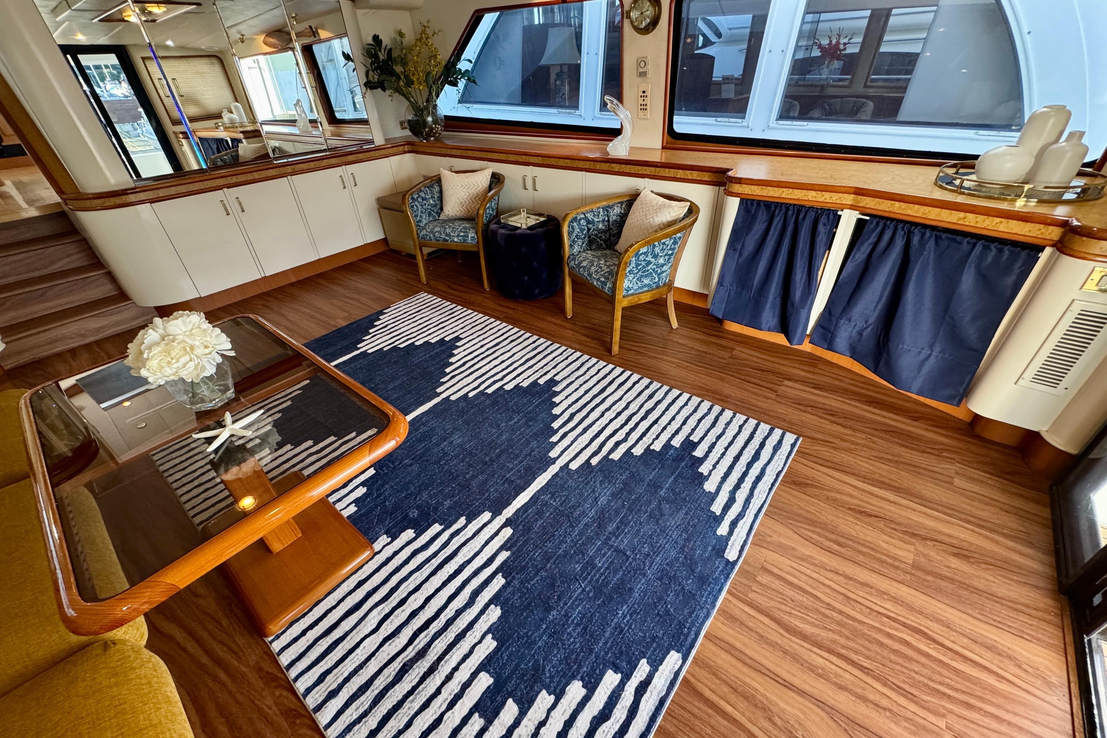 Luxurious interior of 1995 Queenship 62 Pilothouse Motor Yacht with elegant decor and seating.