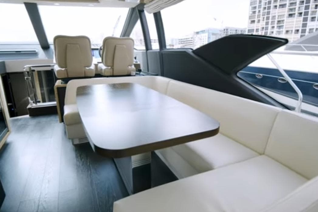 Luxurious interior of 2017 Azimut 66 yacht with elegant seating and modern design.