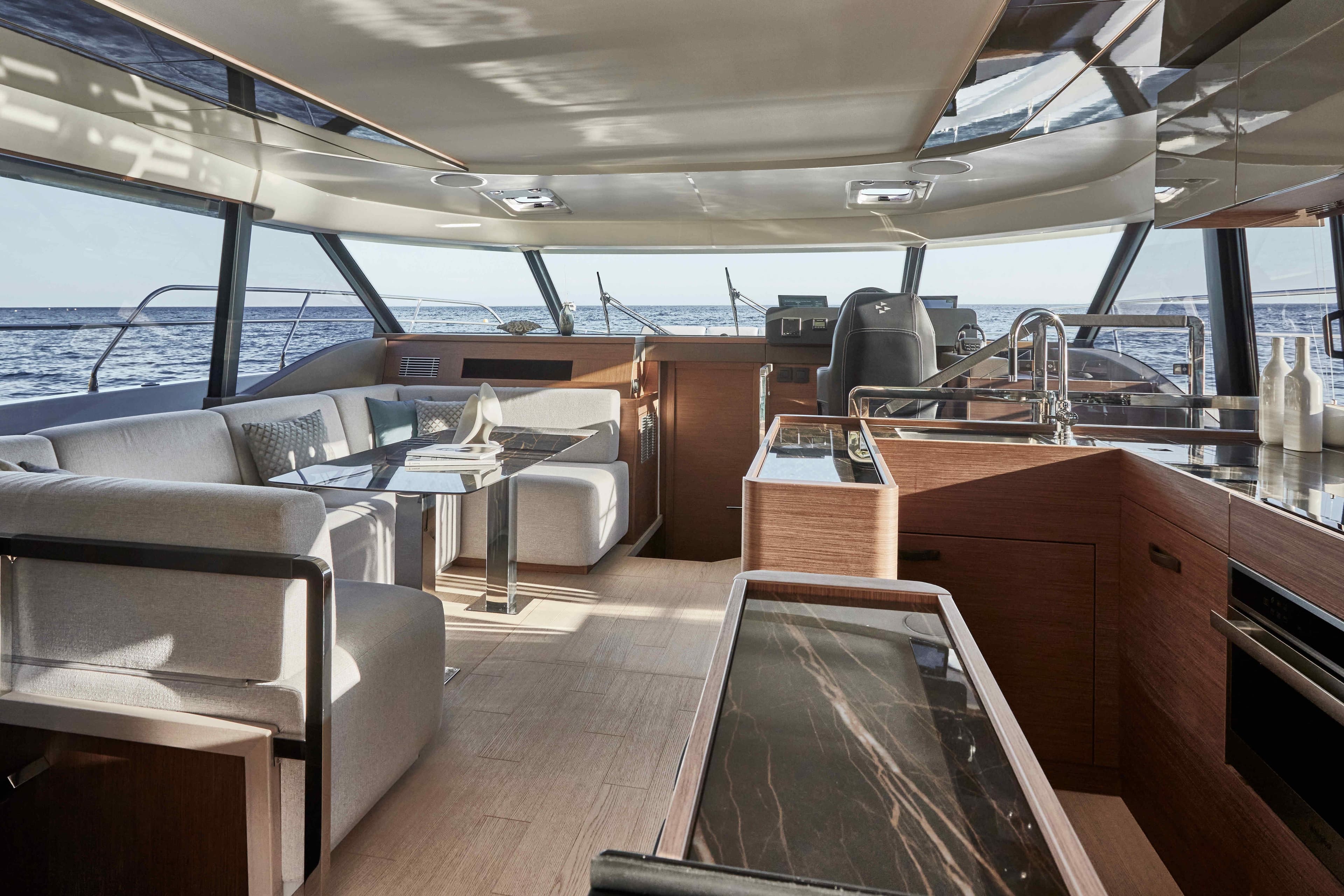 Luxurious interior of 2025 Prestige M48 yacht with modern furnishings and ocean view.