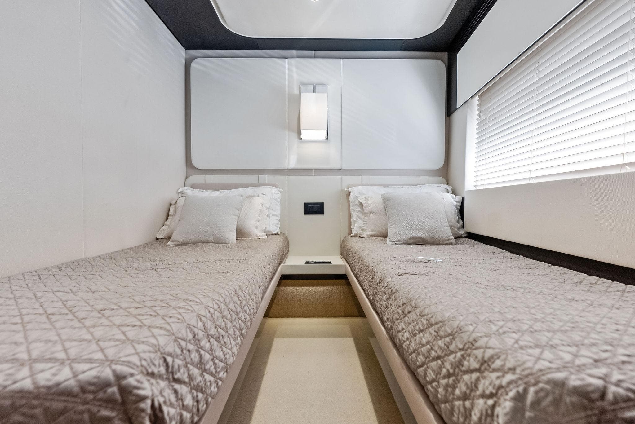 Luxurious twin cabin interior of 2017 Azimut 77S yacht with modern design.