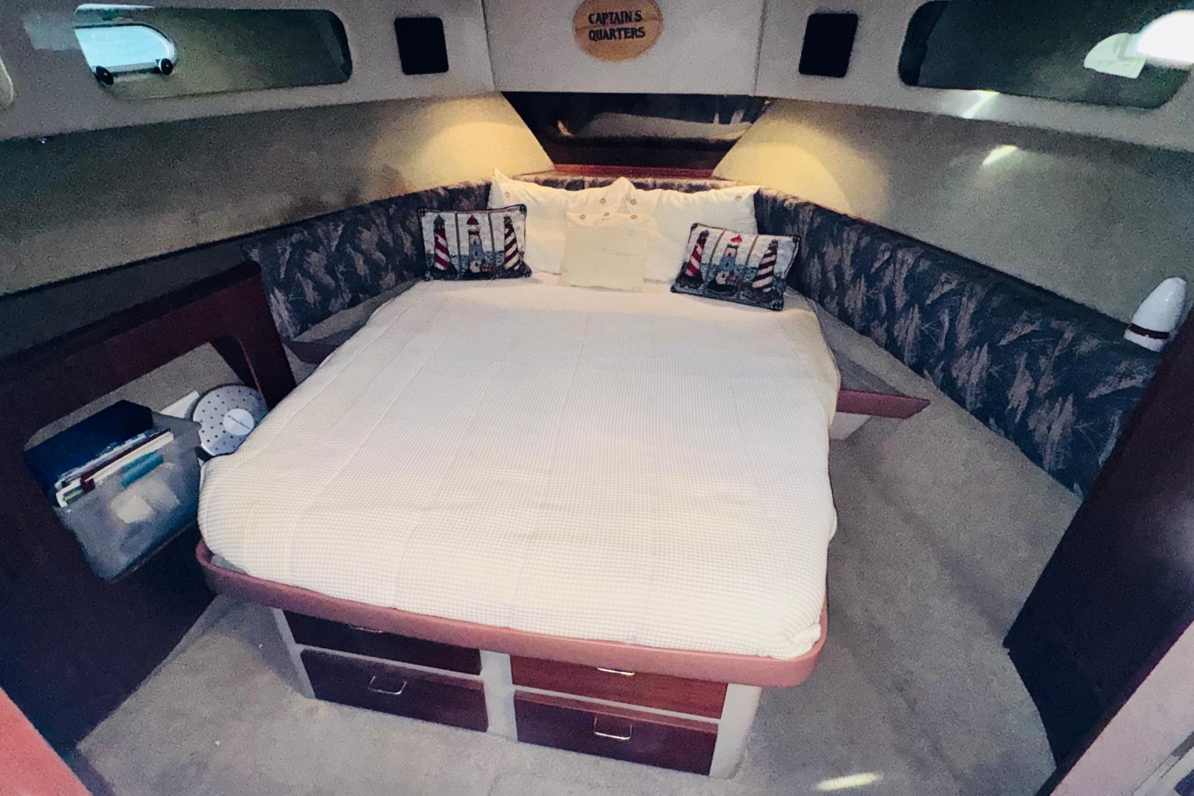 1990 Bayliner 3888 Motoryacht cabin with cozy bed and nautical decor.