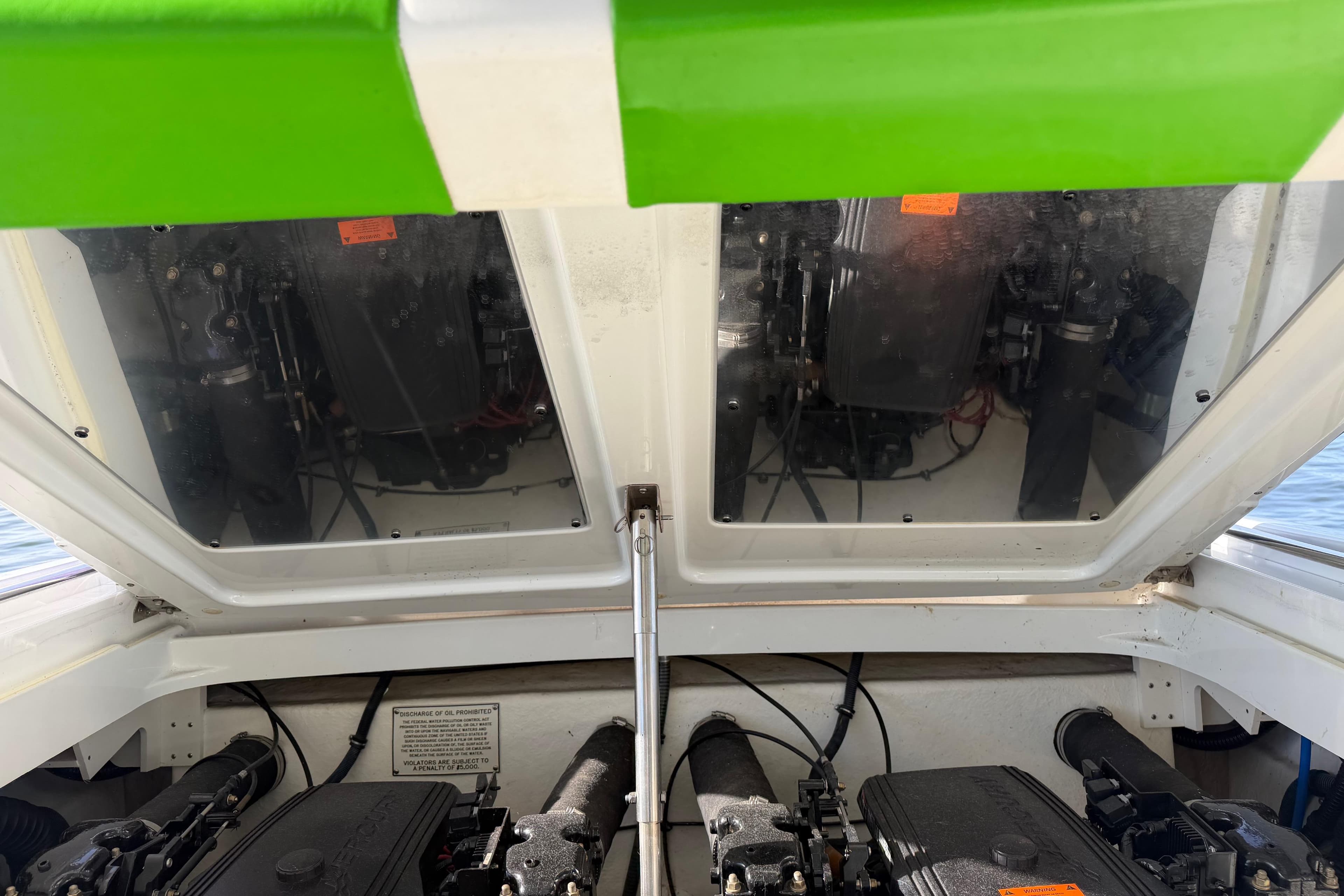Engine compartment of a 2001 Formula 312 FASTech boat with open hatch.