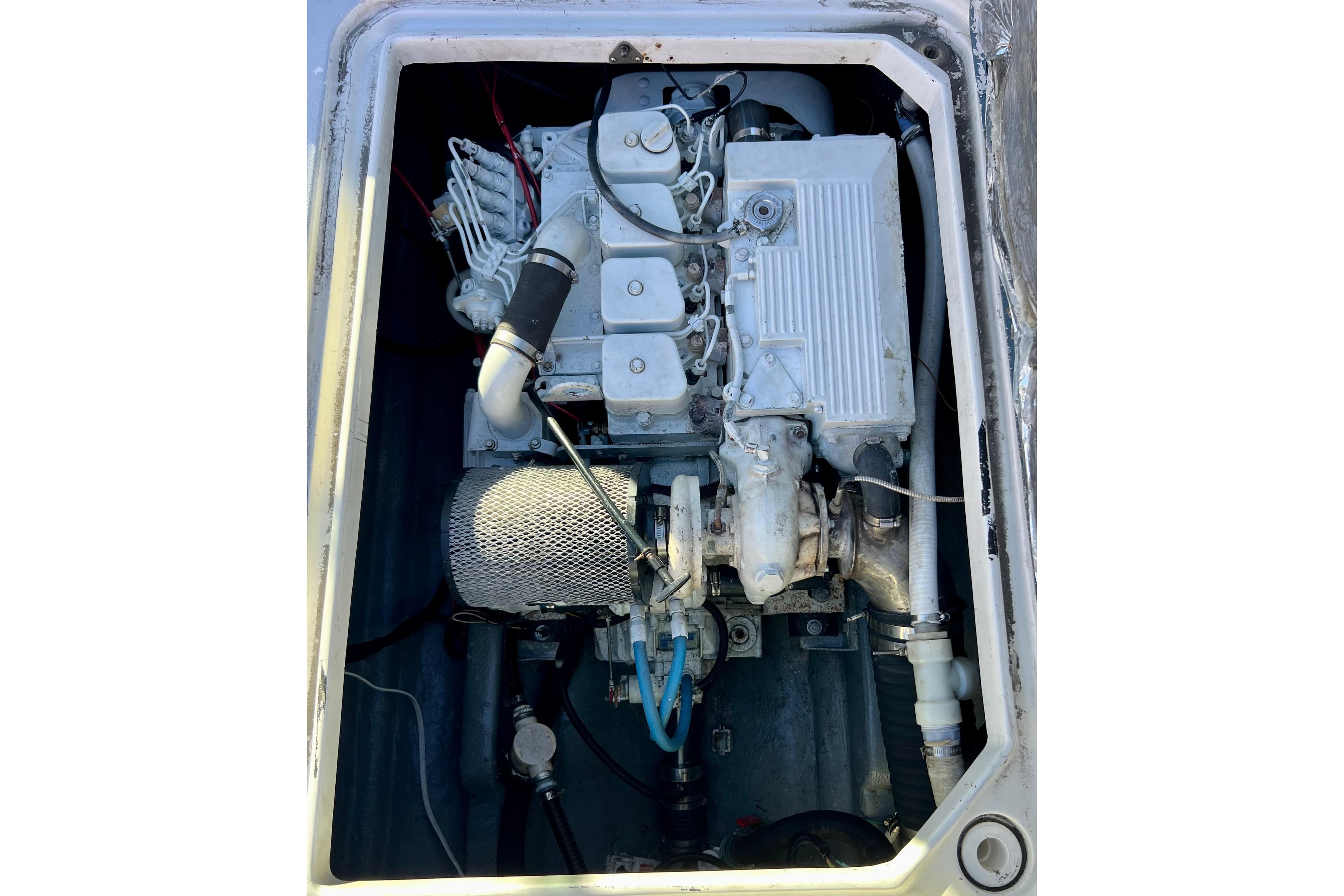 Engine compartment of a 1998 Baha Cruisers 340 CAT boat, showcasing mechanical components.