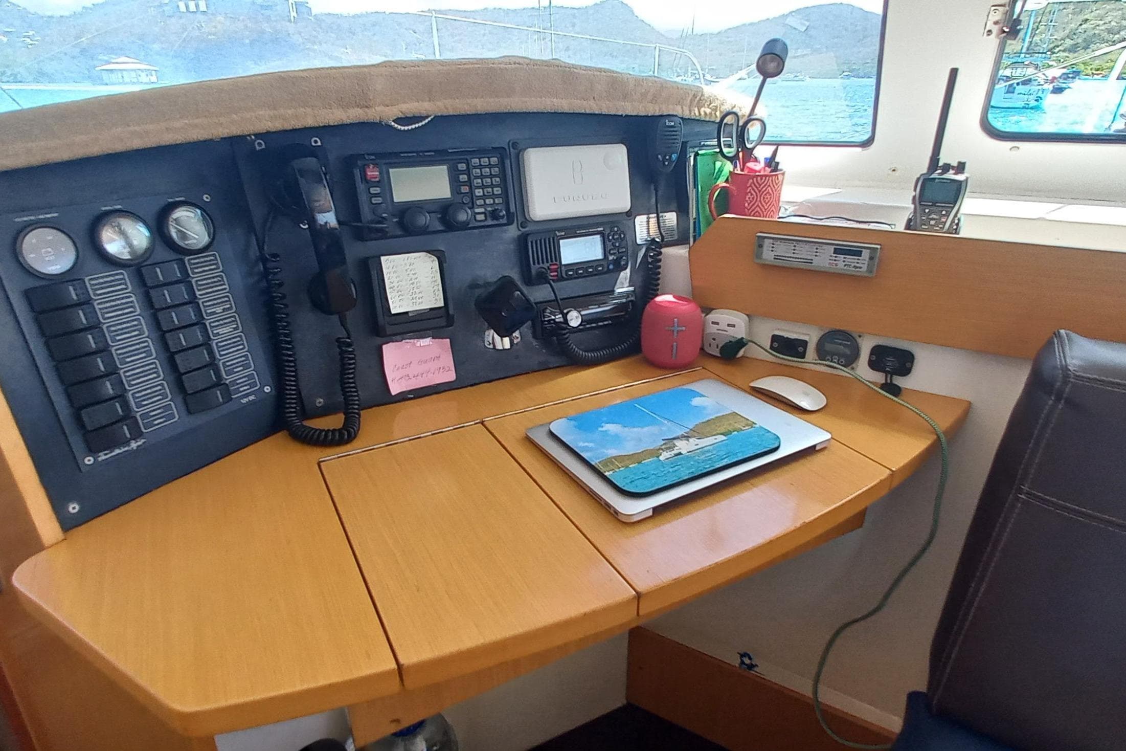 Navigation station of a 2010 Fountaine Pajot Lipari 41 catamaran with control panel and electronics.
