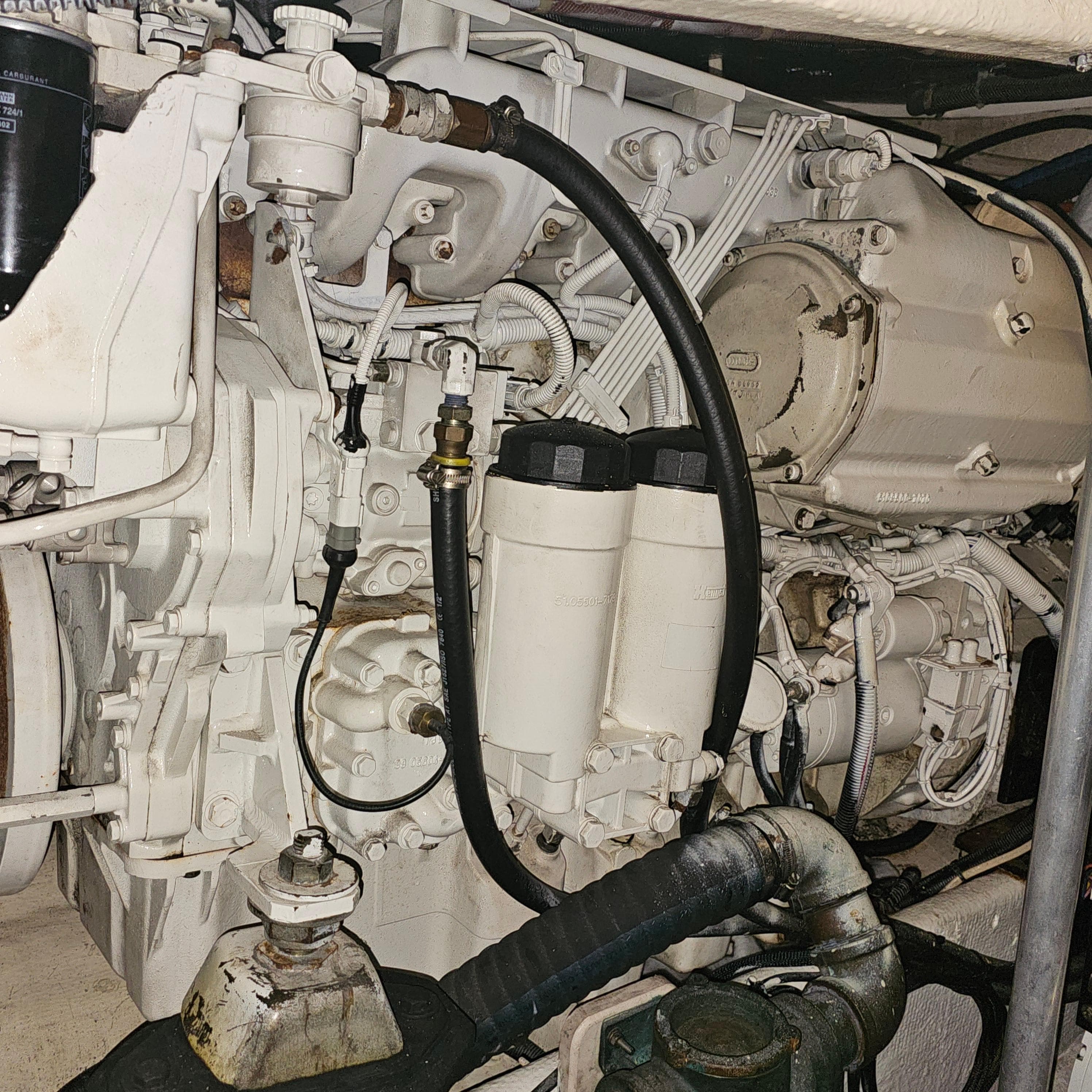 Engine compartment of a 1994 Blackfin 33 Combi boat, showcasing mechanical components.