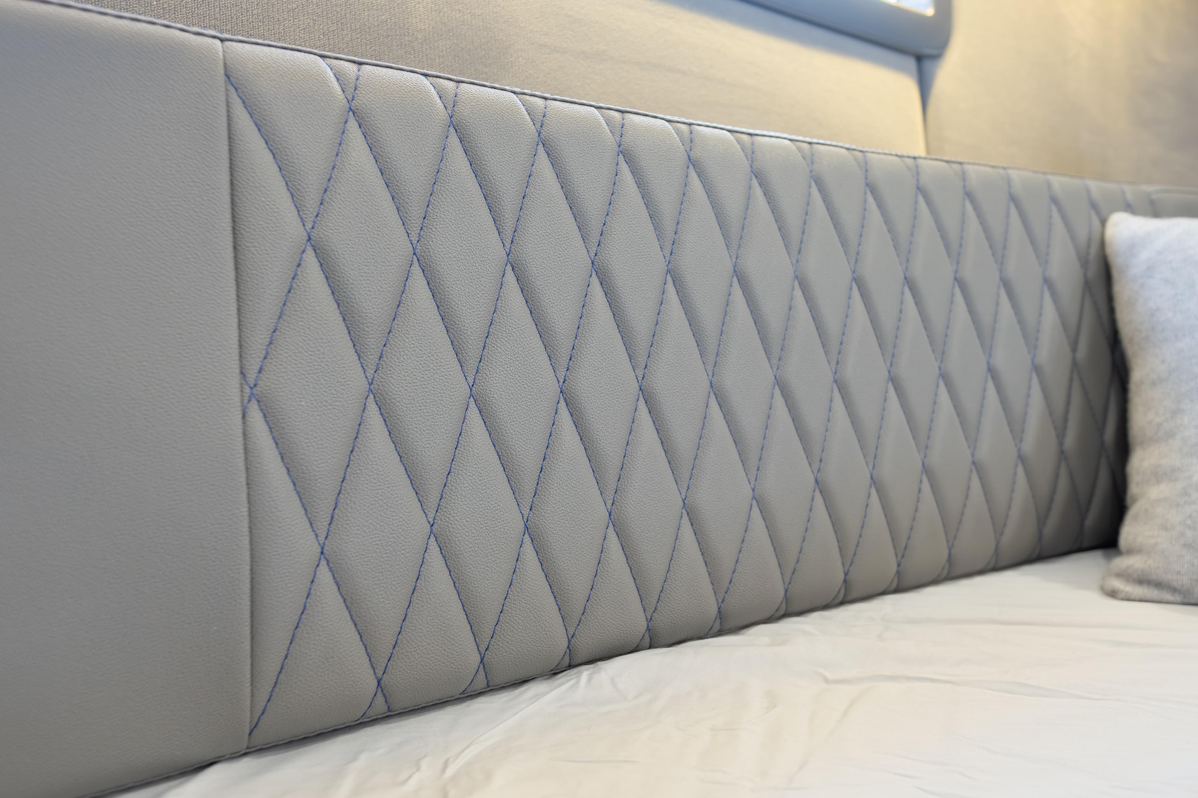 Quilted leather headboard in Hanover 347, 2026 model, with elegant diamond stitching.
