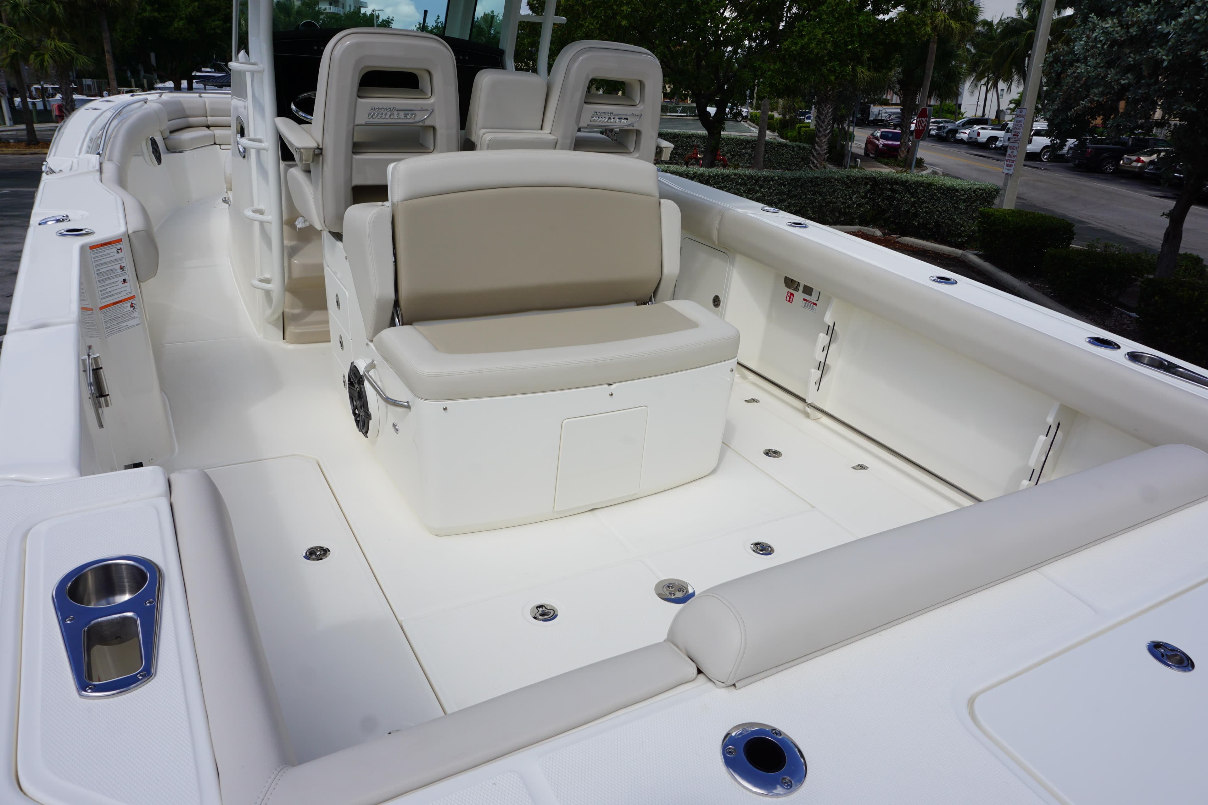 2026 Boston Whaler 330 Outrage boat interior with seating and storage compartments.