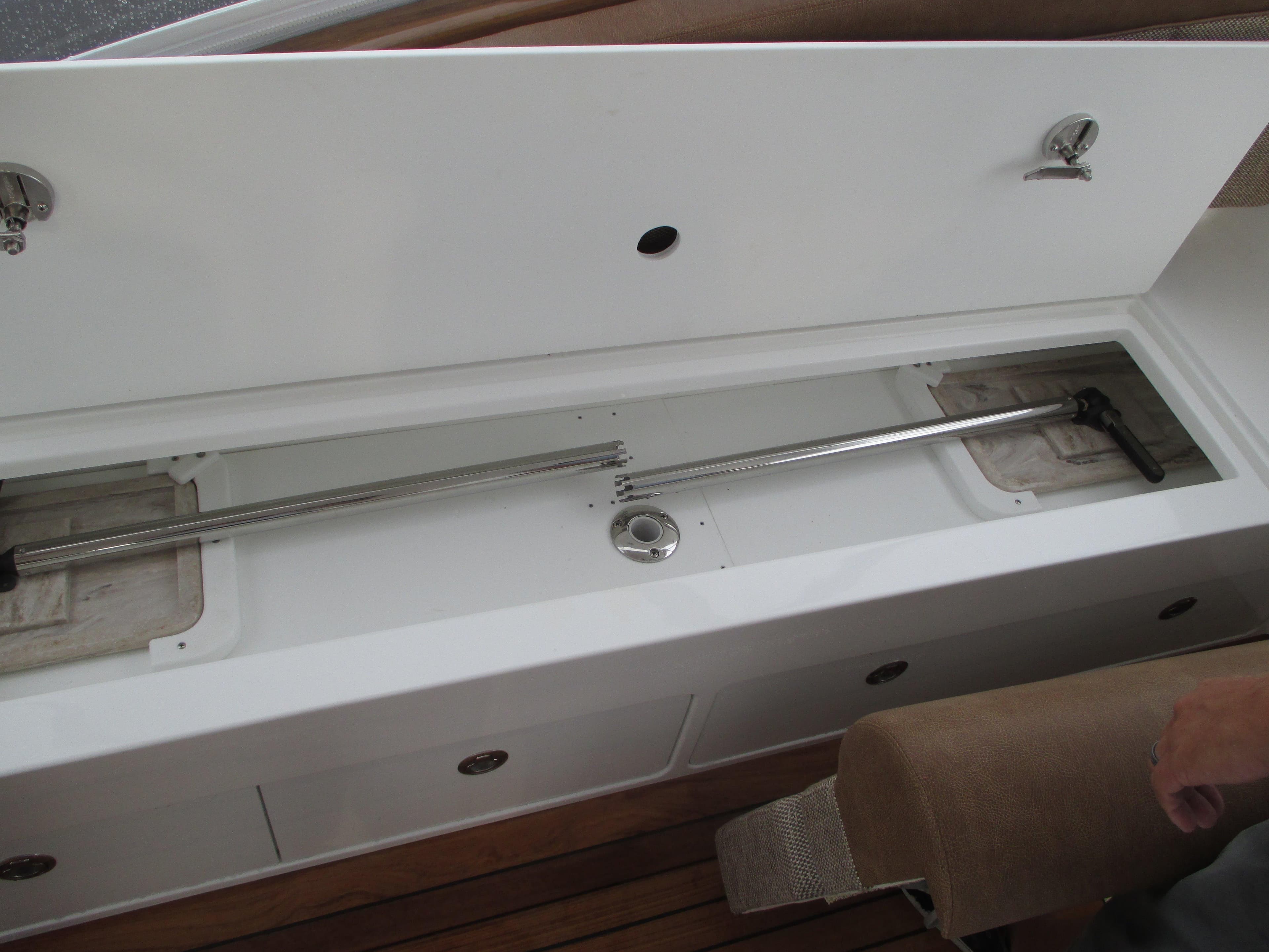 2024 Jersey Cape Devil 36 Custom boat storage compartment with stainless steel rod holders.