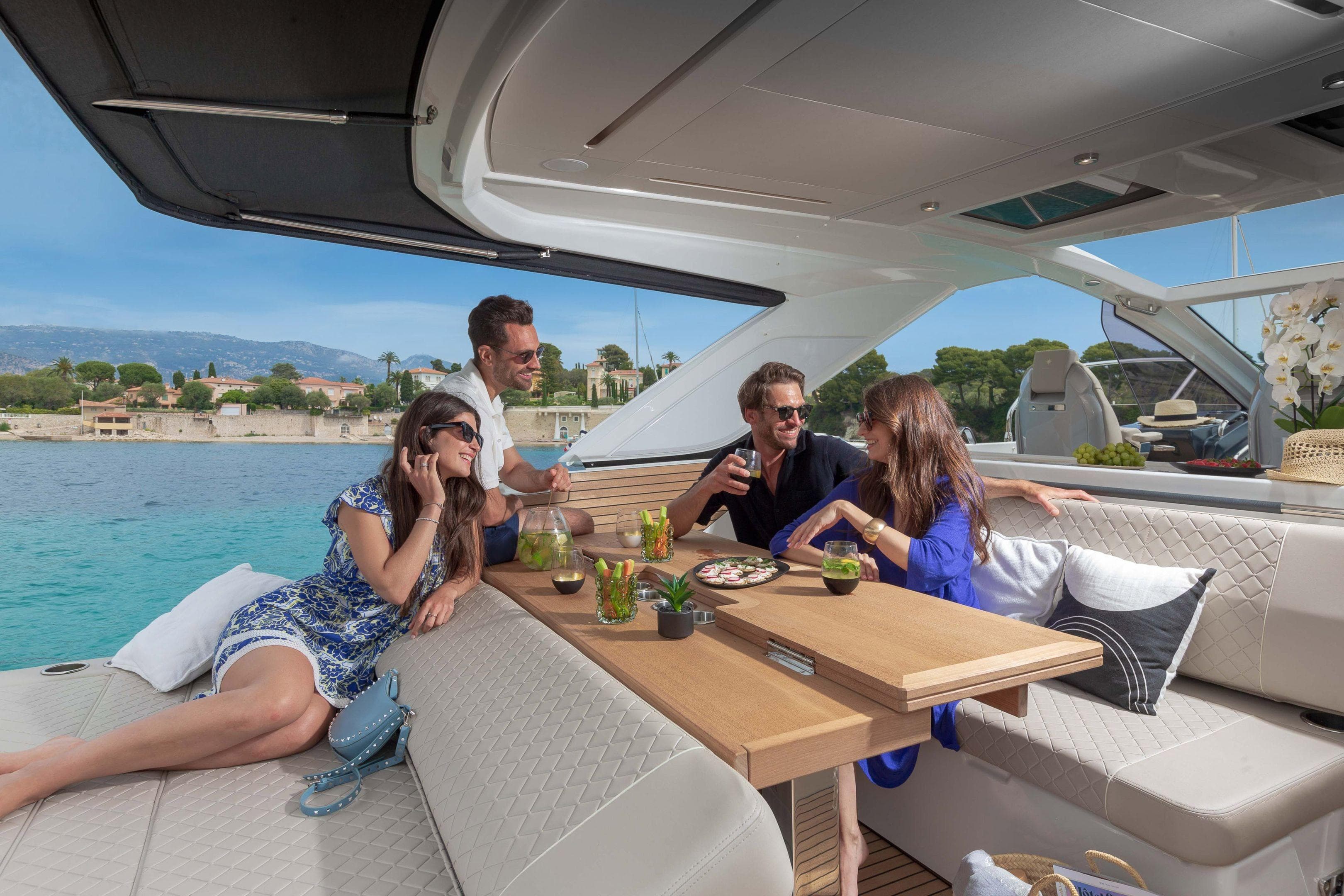 People enjoying leisure time on a 2026 Jeanneau DB/43 IB yacht.