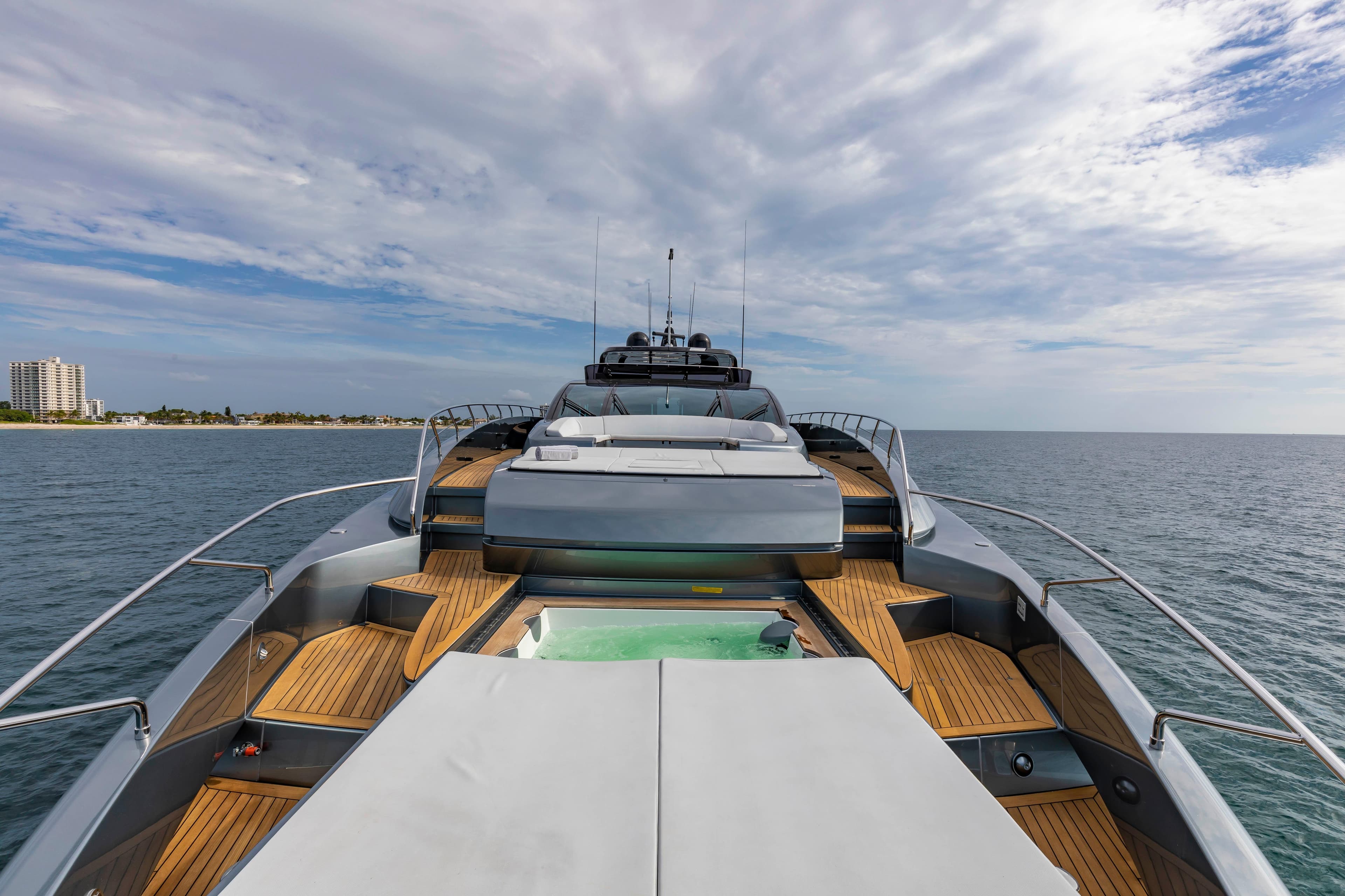 Luxurious 2020 Riva 110' Dolcevita yacht on open sea with wooden deck.