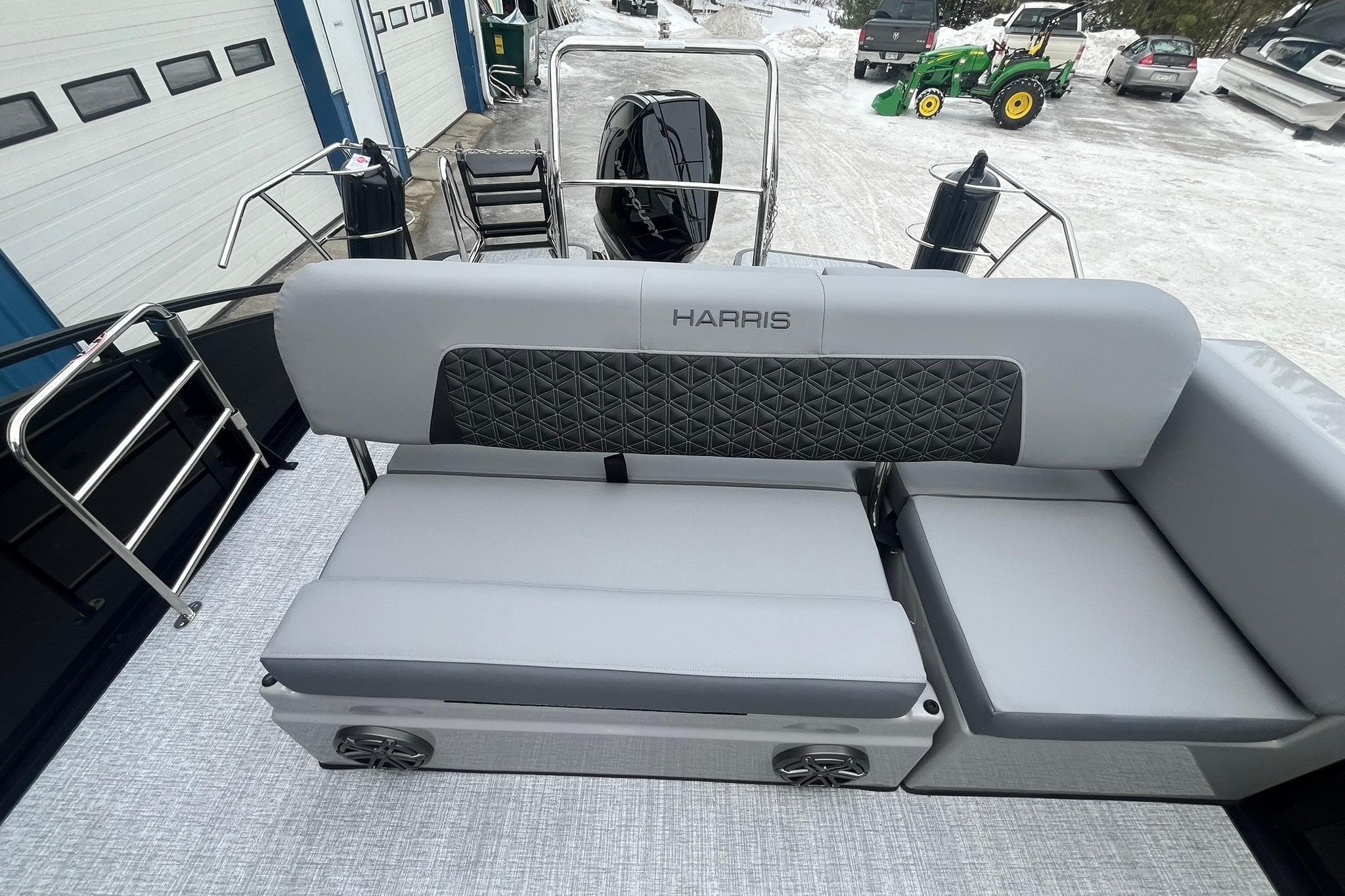 2025 Harris Solstice 230 boat interior with gray seating and quilted backrest.