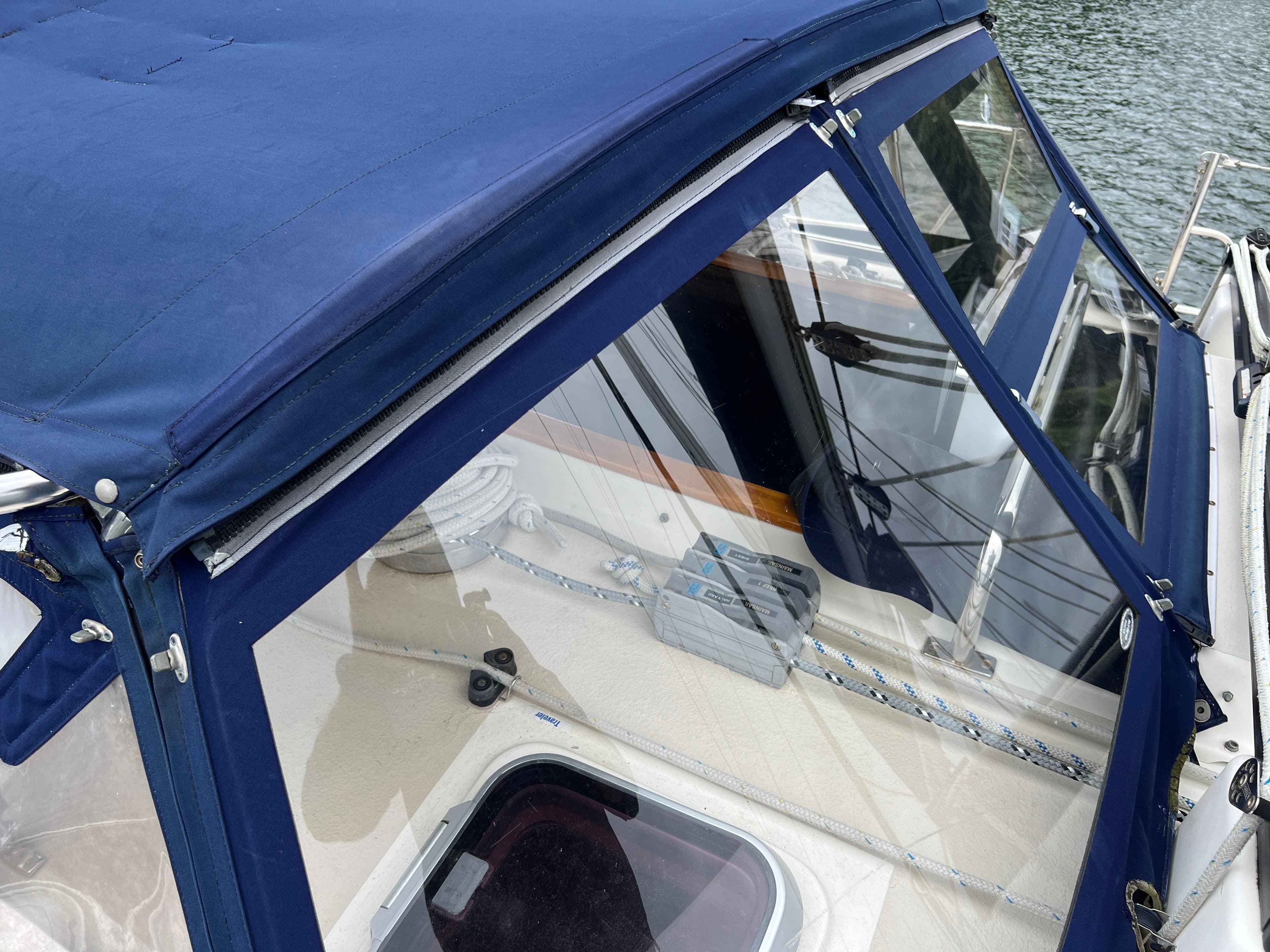 Caliber 40LRC SE 2005 with blue cover and clear windows by the water.